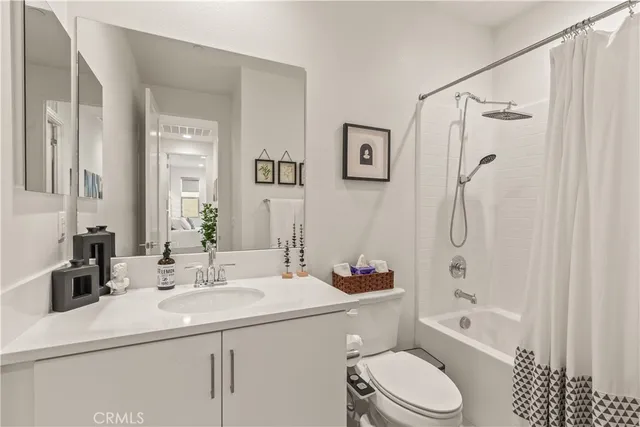 a bathroom with a sink toilet tub and shower