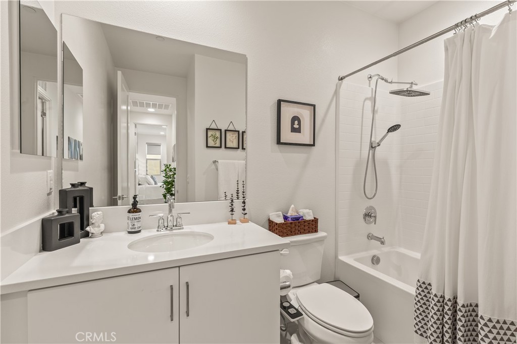 80281 Redstone Way La Quinta, CA 92253 - Photo 13 of 21 a bathroom with a sink toilet tub and shower