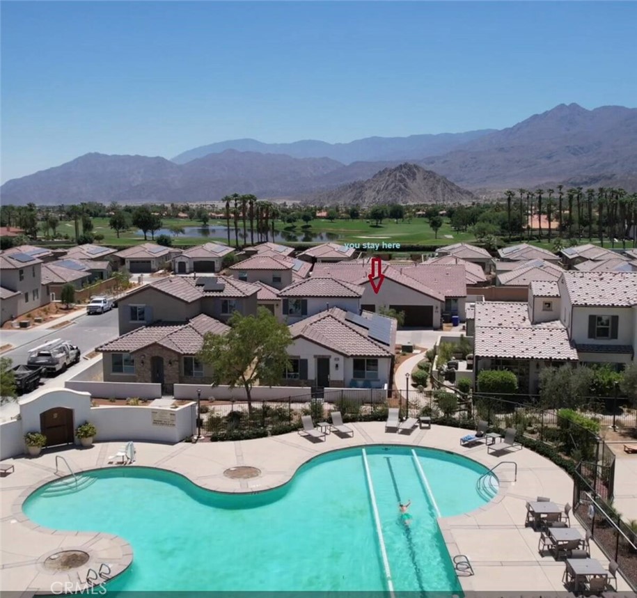 80281 Redstone Way La Quinta, CA 92253 - Photo 19 of 21 a view of a patio with couches and a table and chairs