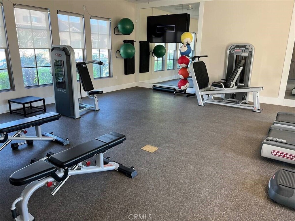 80281 Redstone Way La Quinta, CA 92253 - Photo 20 of 21 a view of a room with gym equipment