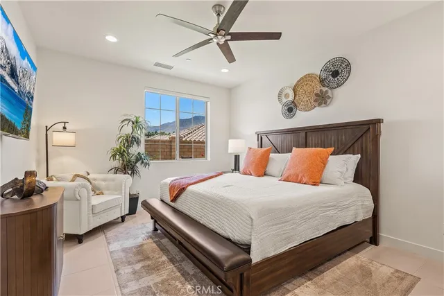 a bedroom with a bed and window