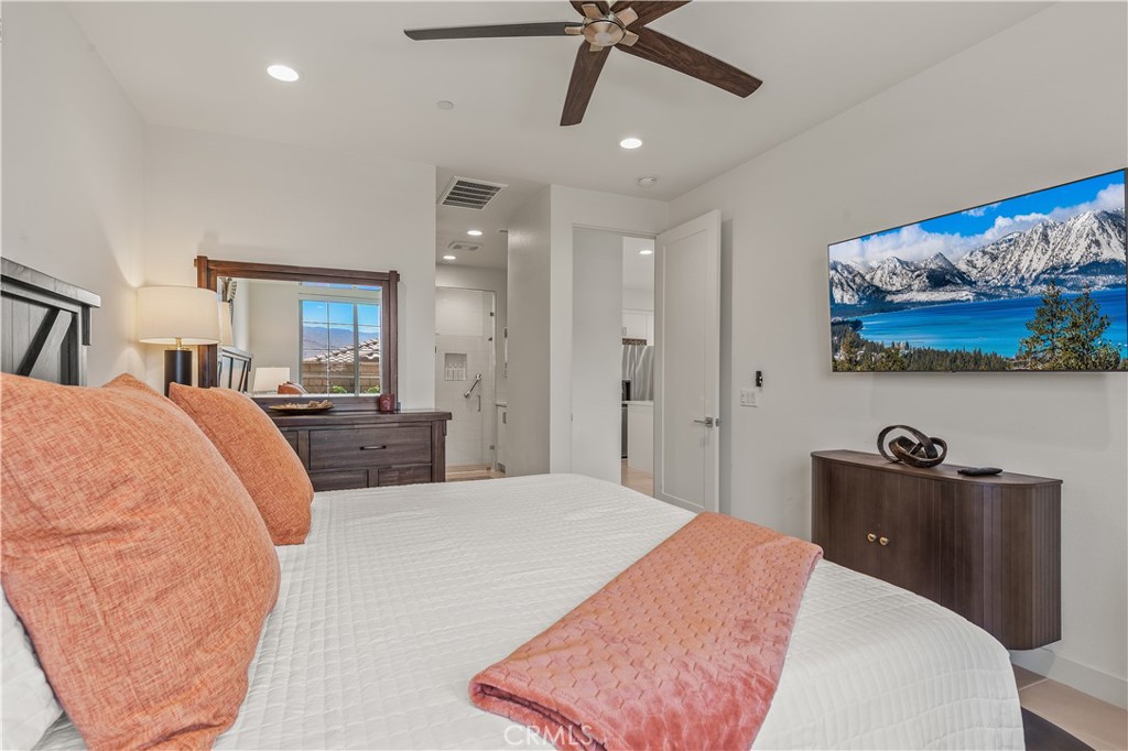 80281 Redstone Way La Quinta, CA 92253 - Photo 9 of 21 a bed room with a bed and dresser