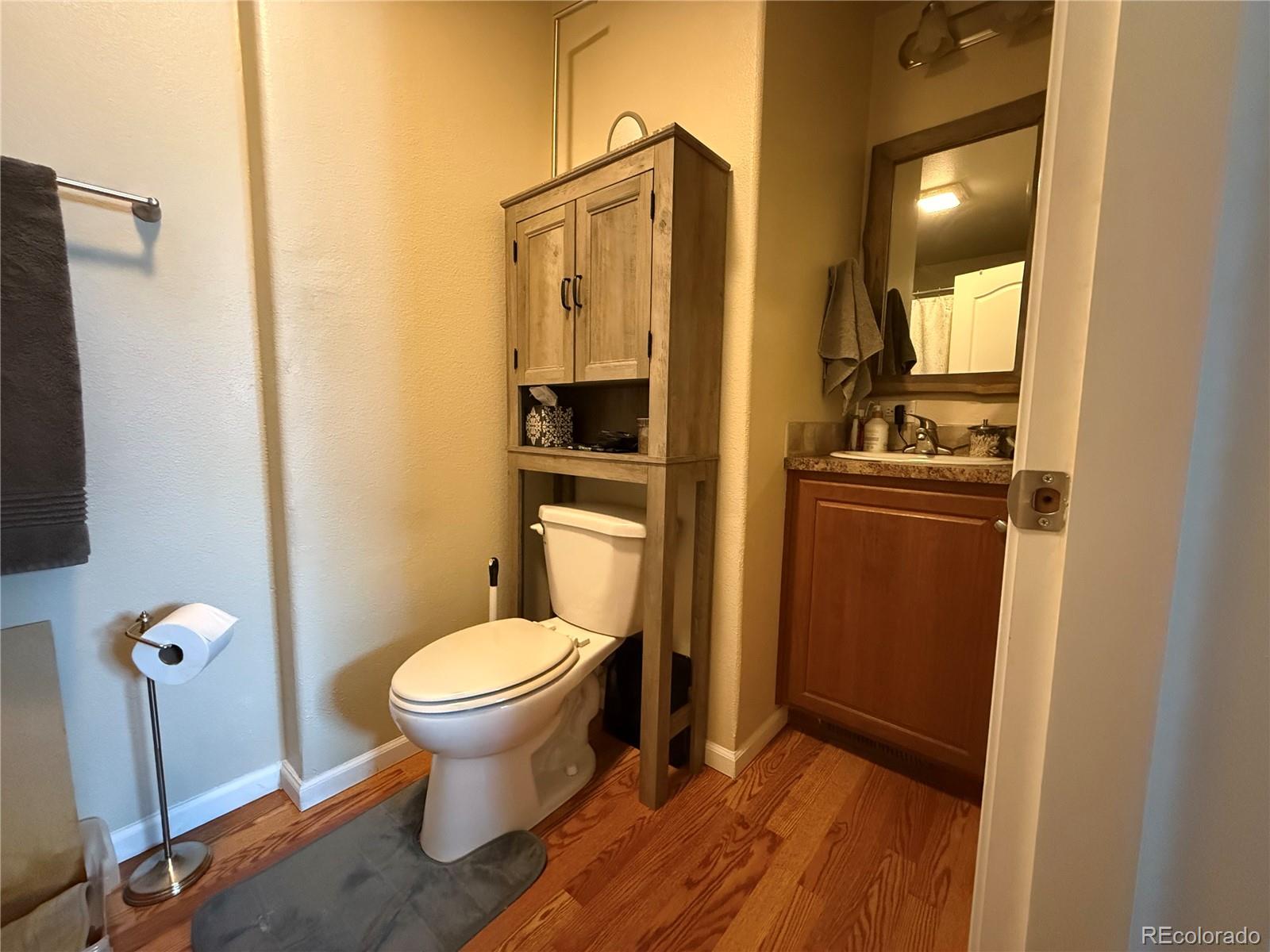 17190 Mt Vernon Road Golden, CO 80401 - Photo 11 of 21 a bathroom with a toilet and a sink
