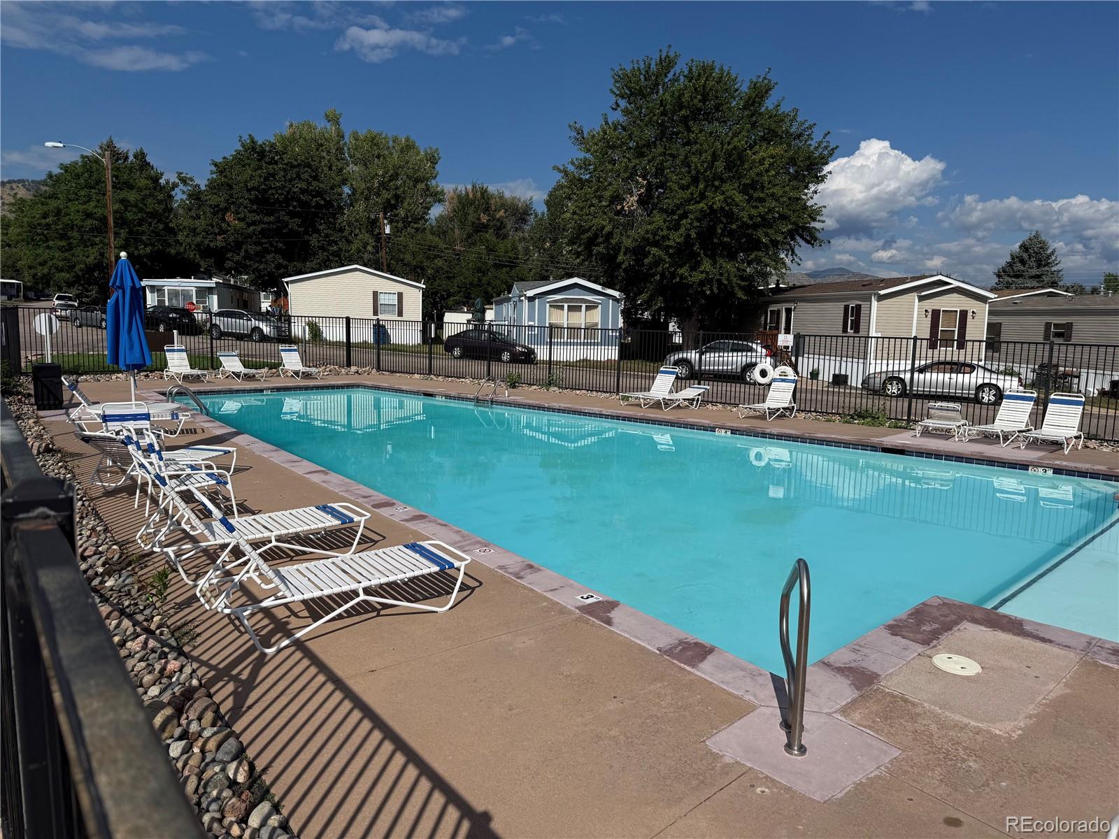 17190 Mt Vernon Road Golden, CO 80401 - Photo 19 of 21 a view of multiple houses with outdoor space