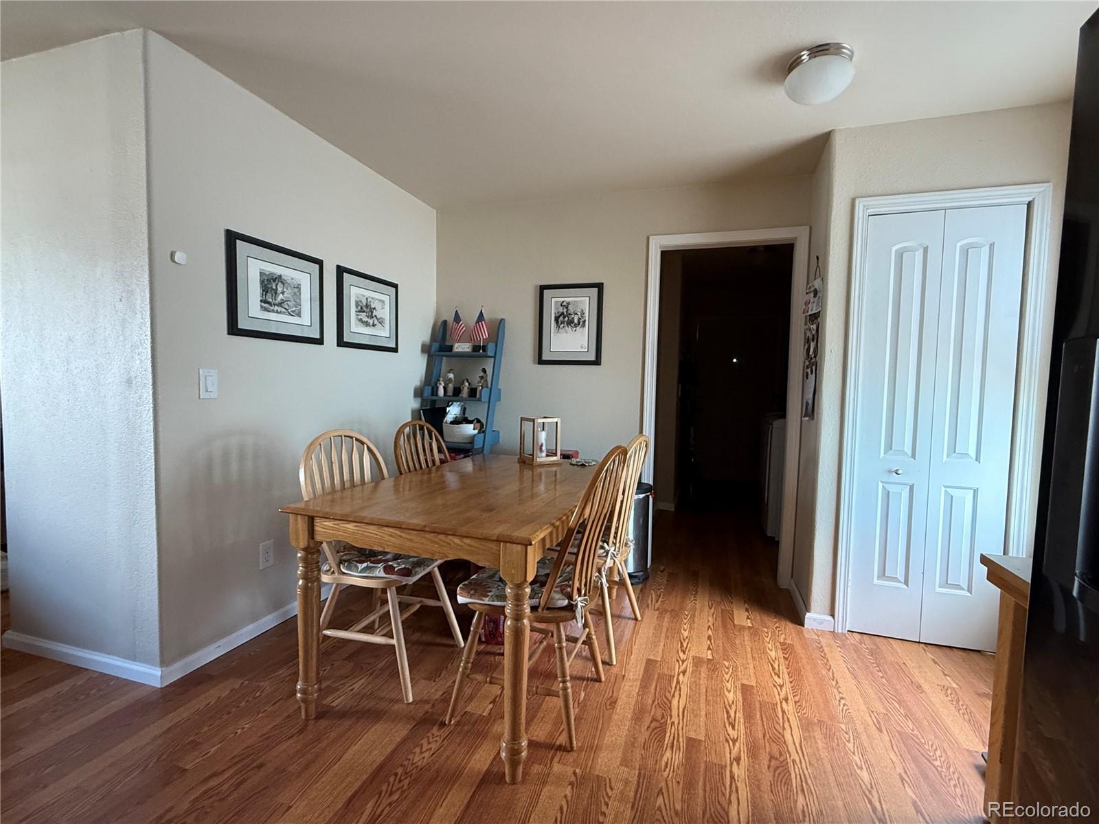 17190 Mt Vernon Road Golden, CO 80401 - Photo 8 of 21 a view of a dining room with furniture and wooden floor