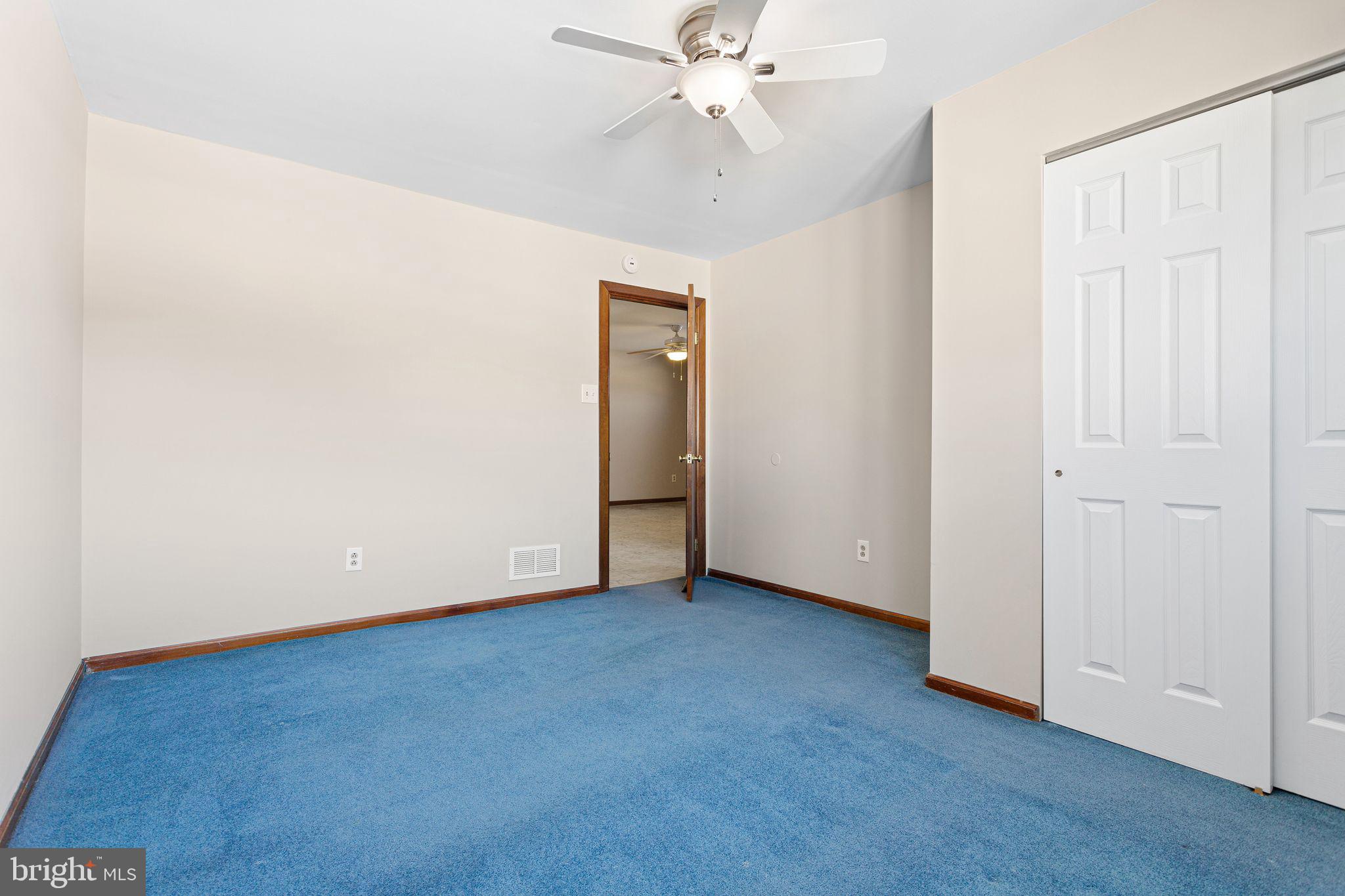 2623 Knights Road Bensalem, PA 19020 - Photo 36 of 50 an empty room with a ceiling fan and a window