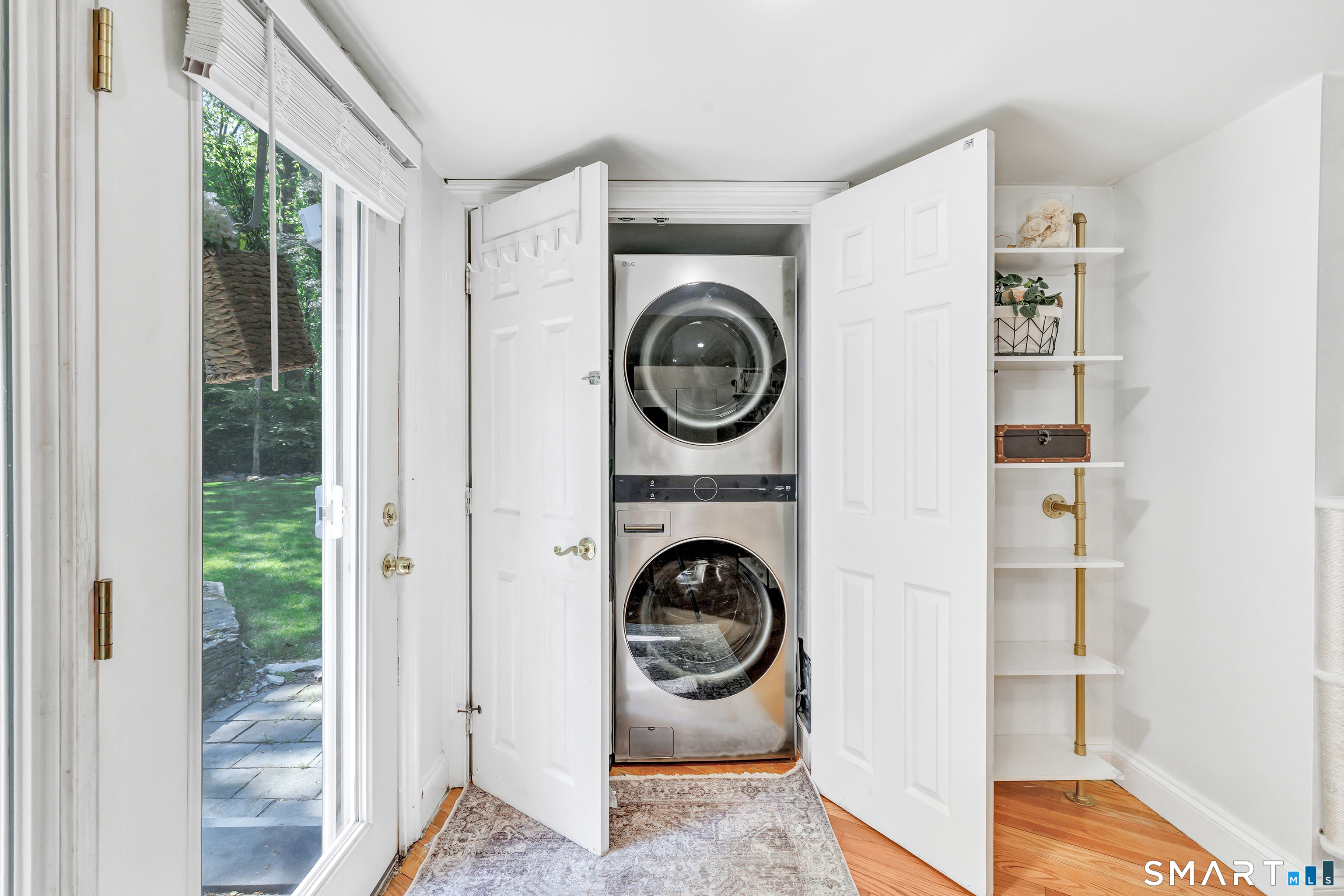 57 Olmstead Road Redding, CT 06896 - Photo 17 of 22 a view of a storage and utility room with washer and dryer