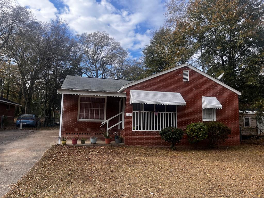 1081 Benner Avenue Columbus, GA 31906 - Photo 1 of 4 a front view of a house with garden