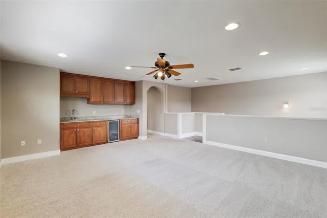a view of a kitchen with a sink and a stove top oven