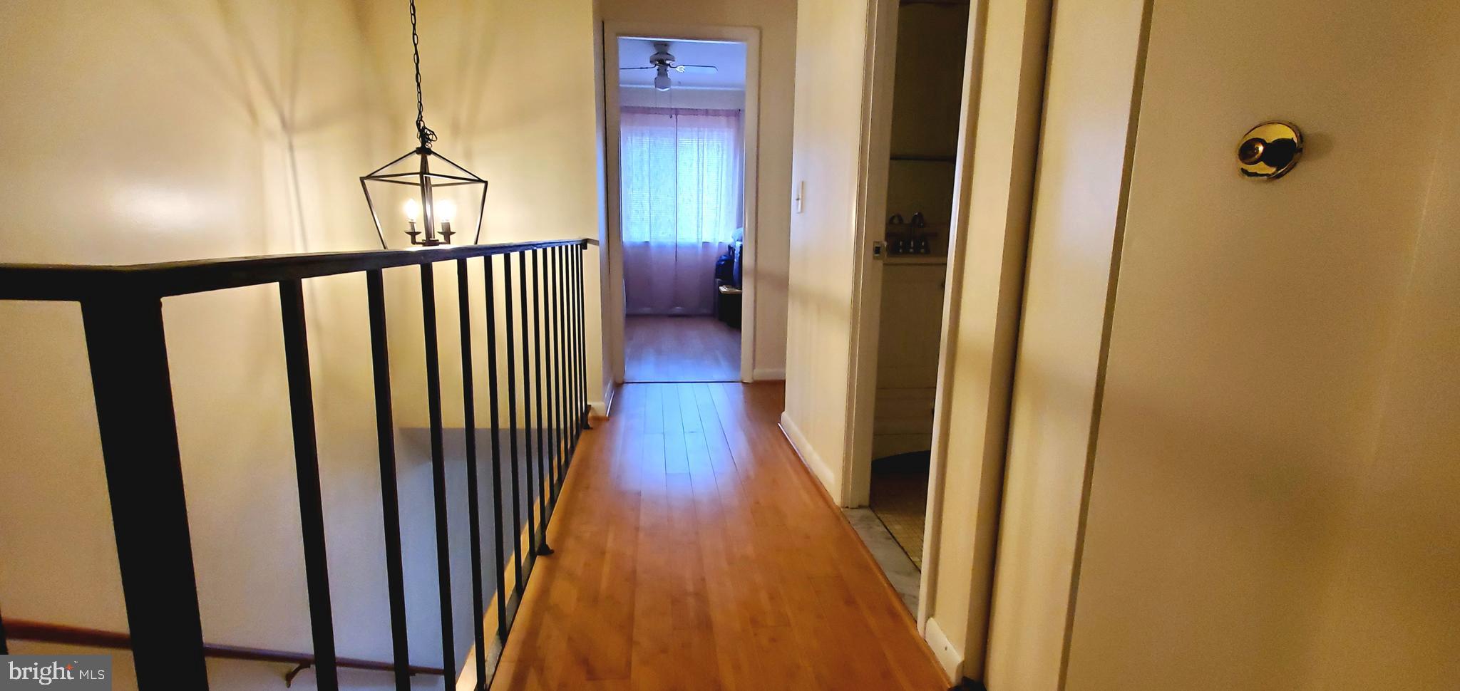 11712 Decade Court Reston, VA 20191 - Photo 11 of 18 HARDWOOD HALLWAY TO SECONDARY BEDROOMS