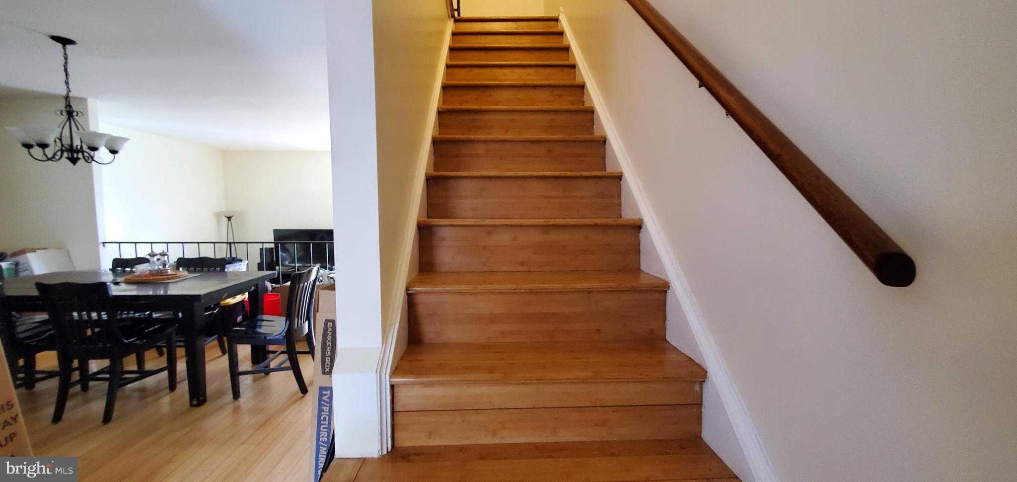 11712 Decade Court Reston, VA 20191 - Photo 8 of 18 HARDWOOD STAIRS TO THE BEDROOM LEVEL