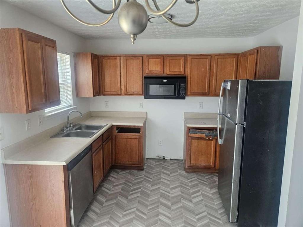 9432 Lakeview Road Union City, GA 30291 - Photo 2 of 10 a kitchen with stainless steel appliances granite countertop a refrigerator sink and stove