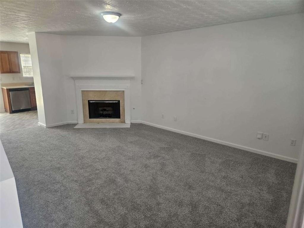 9432 Lakeview Road Union City, GA 30291 - Photo 4 of 10 a view of an empty room with a fireplace