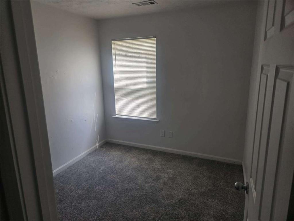 9432 Lakeview Road Union City, GA 30291 - Photo 6 of 10 an empty room with a window