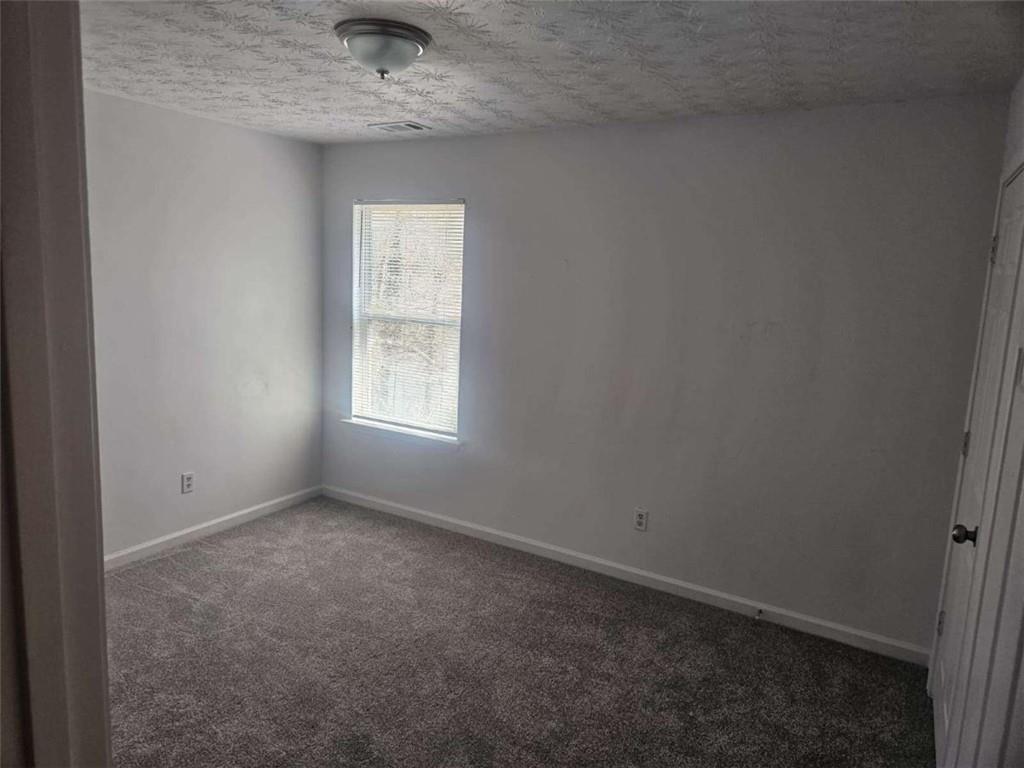 9432 Lakeview Road Union City, GA 30291 - Photo 8 of 10 a view of an empty room with a window