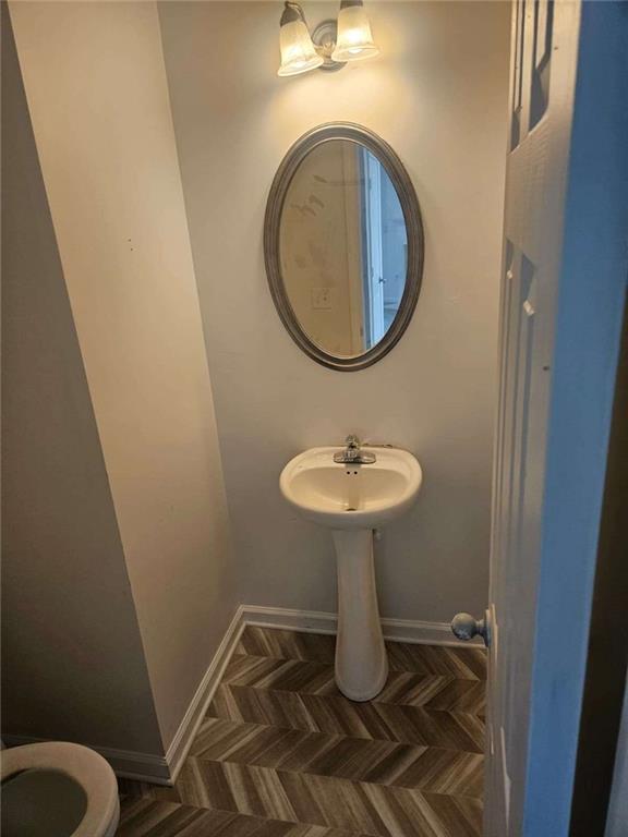 9432 Lakeview Road Union City, GA 30291 - Photo 9 of 10 a bathroom with a sink toilet and a mirror