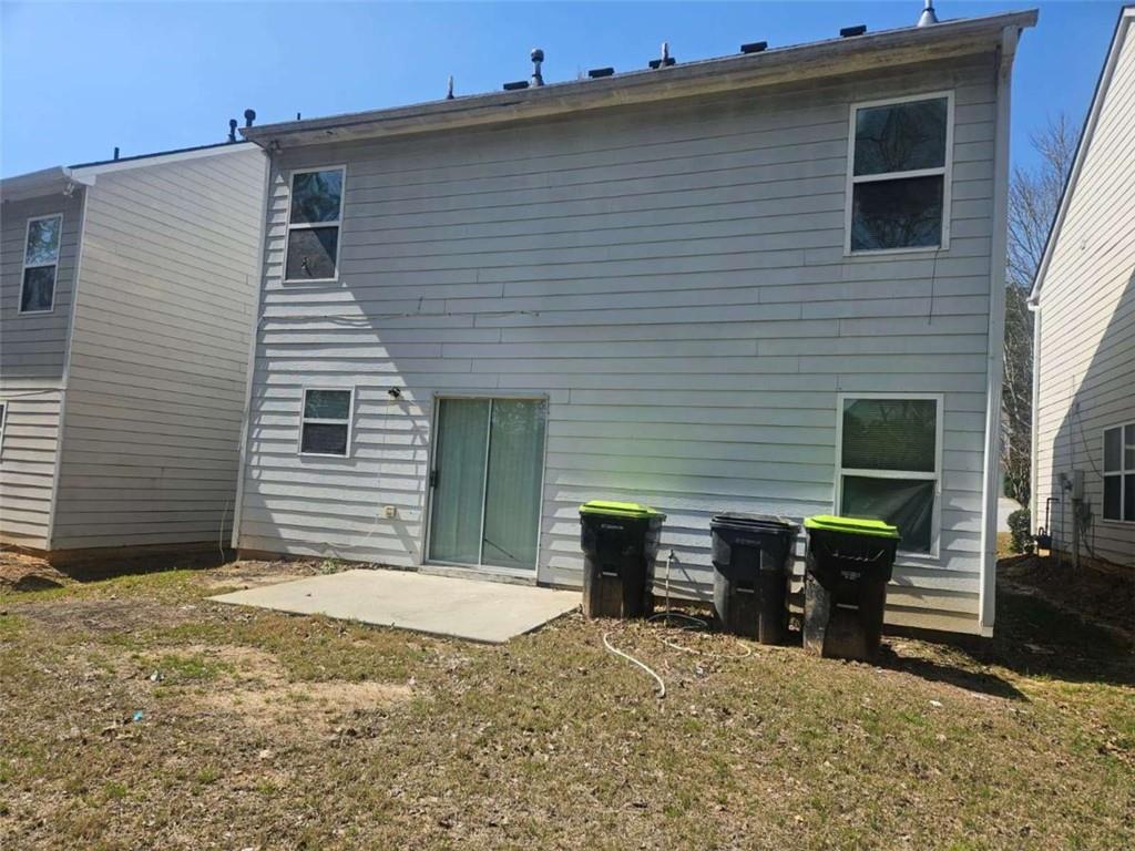 9432 Lakeview Road Union City, GA 30291 - Photo 10 of 10 a view of a house with a backyard