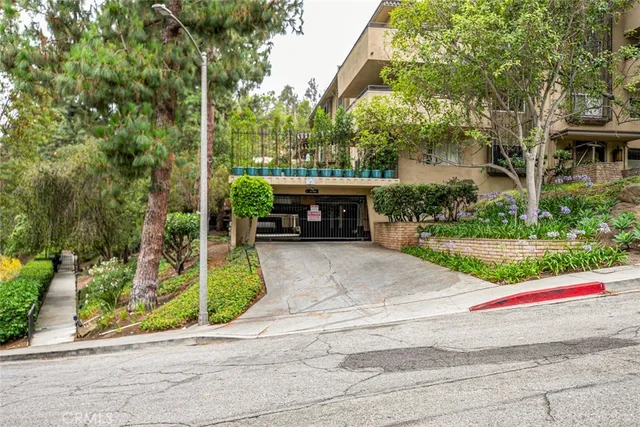 a view of house with outdoor space and trees
