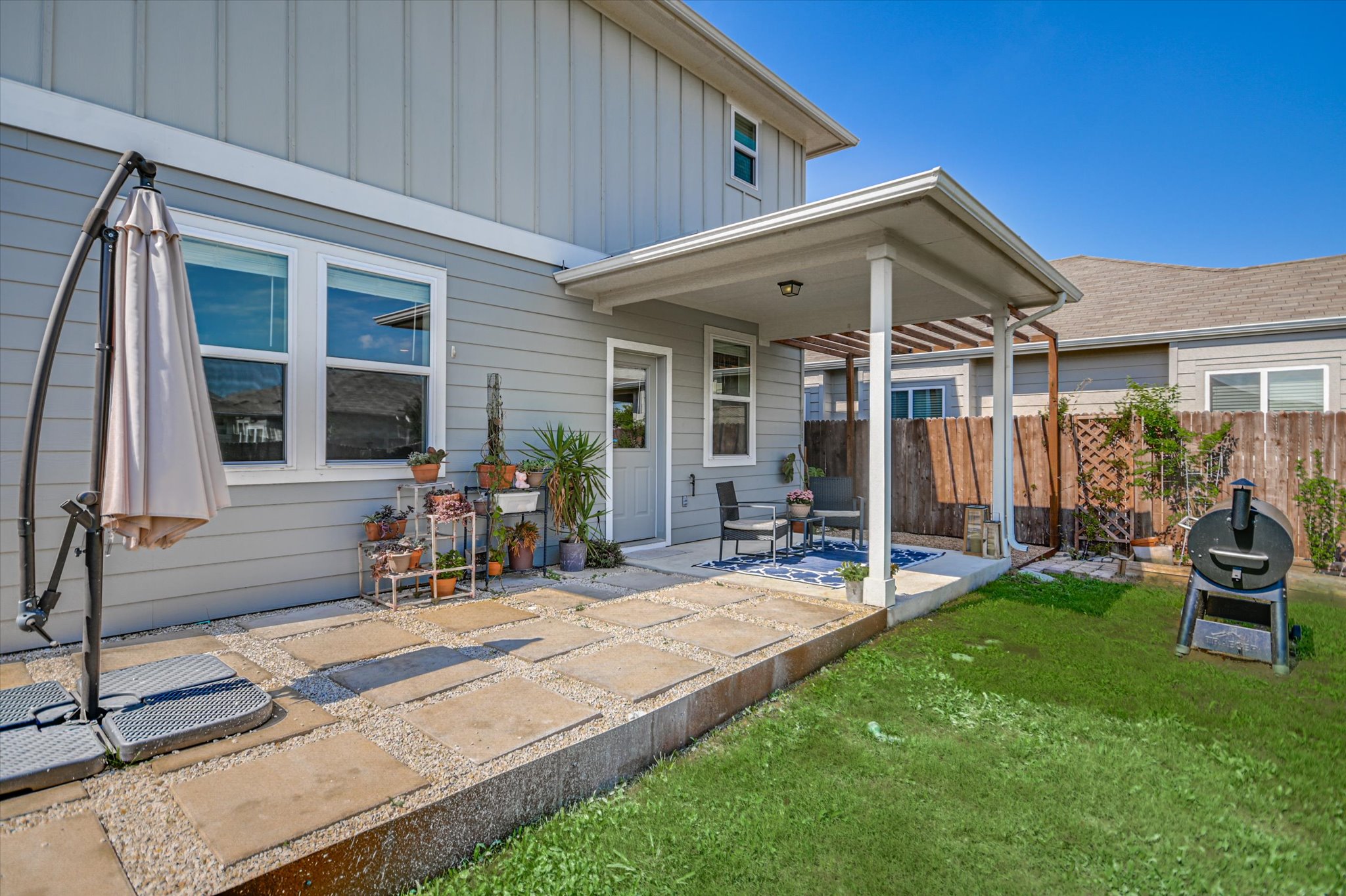 6304 Gunflint Drive Austin, TX 78747 - Photo 19 of 28 String lights, a smoker, good company, your backyard is already doing the most.
