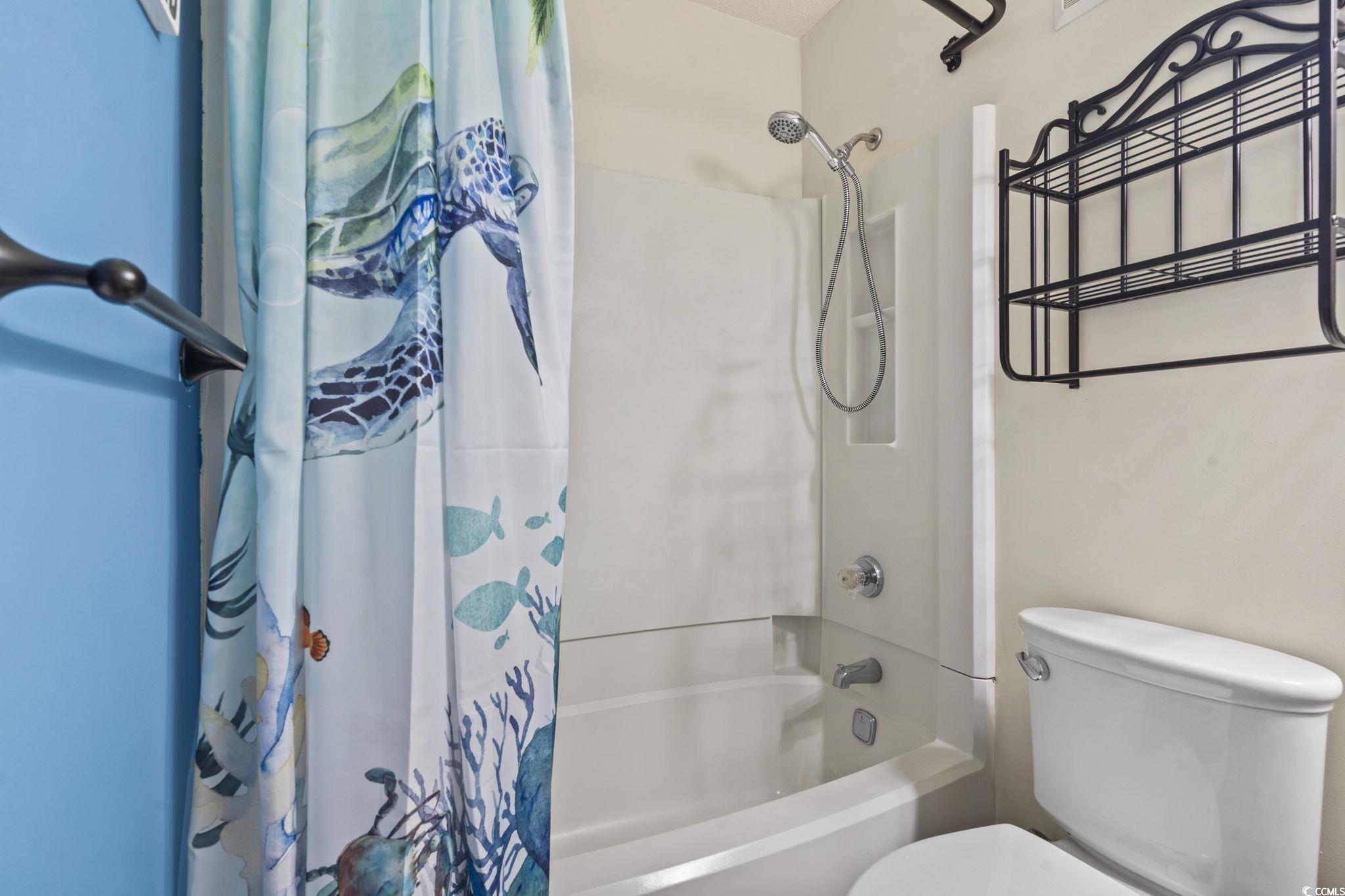 5905 South Kings Highway, Unit 451B Myrtle Beach, SC 29575 - Photo 16 of 37 Full bathroom featuring shower / bathtub combination with curtain and toilet