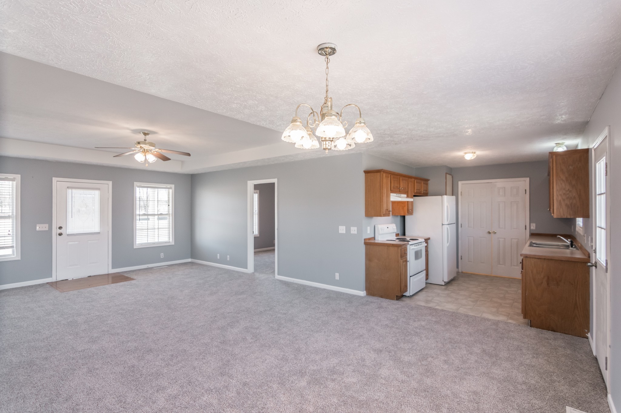 361 Corinth Road Portland, TN 37148 - Photo 14 of 46 a view of a kitchen with a stove cabinets and a chandelier