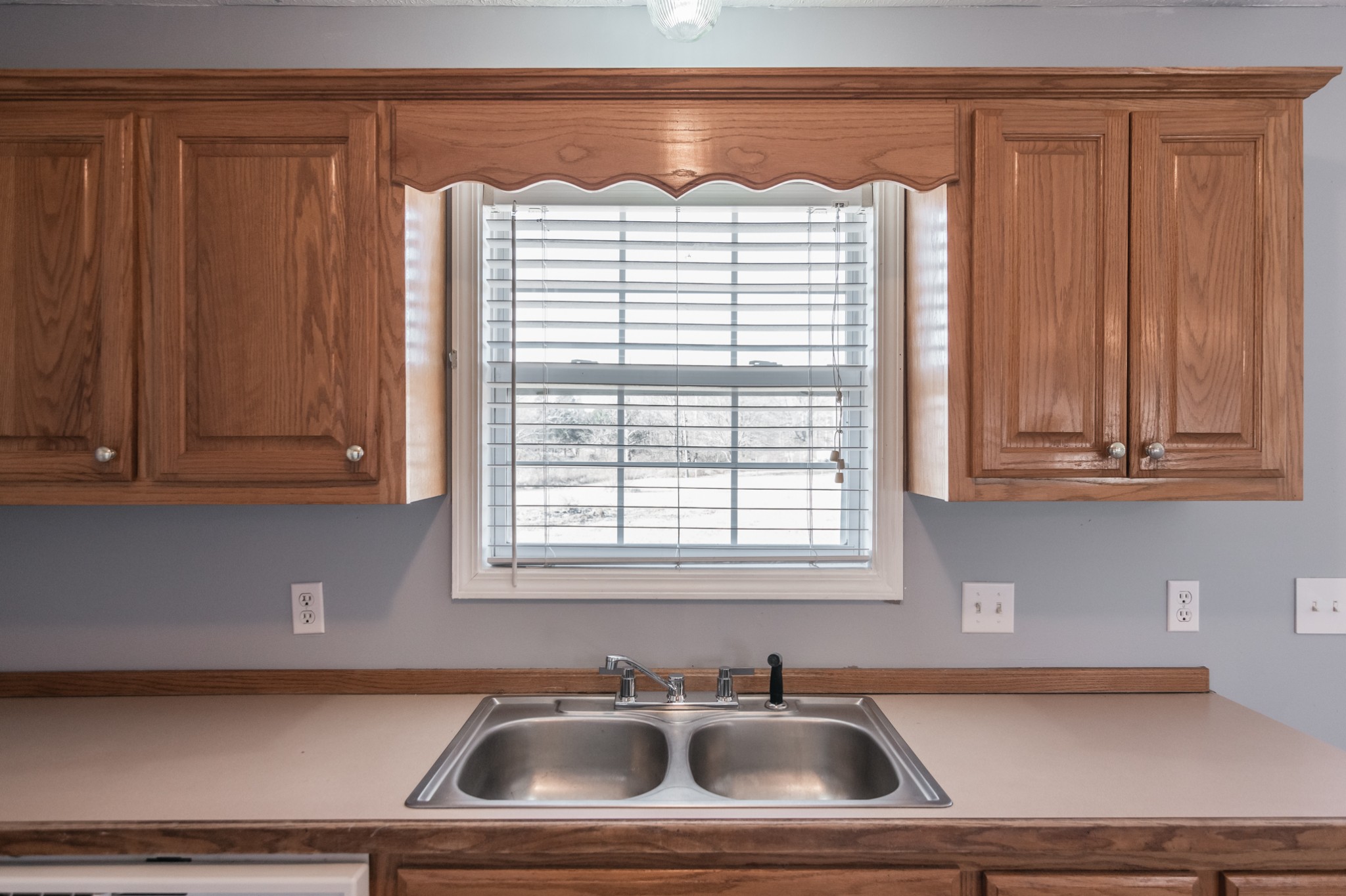 361 Corinth Road Portland, TN 37148 - Photo 17 of 46 a kitchen with a sink and cabinets