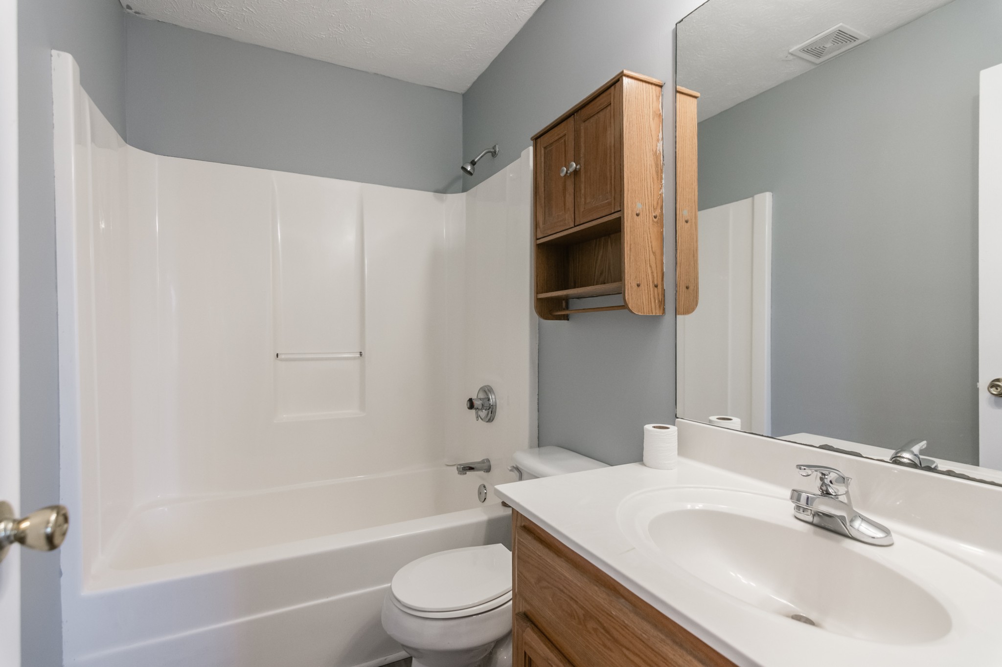 361 Corinth Road Portland, TN 37148 - Photo 24 of 46 a bathroom with a sink a toilet a mirror and shower