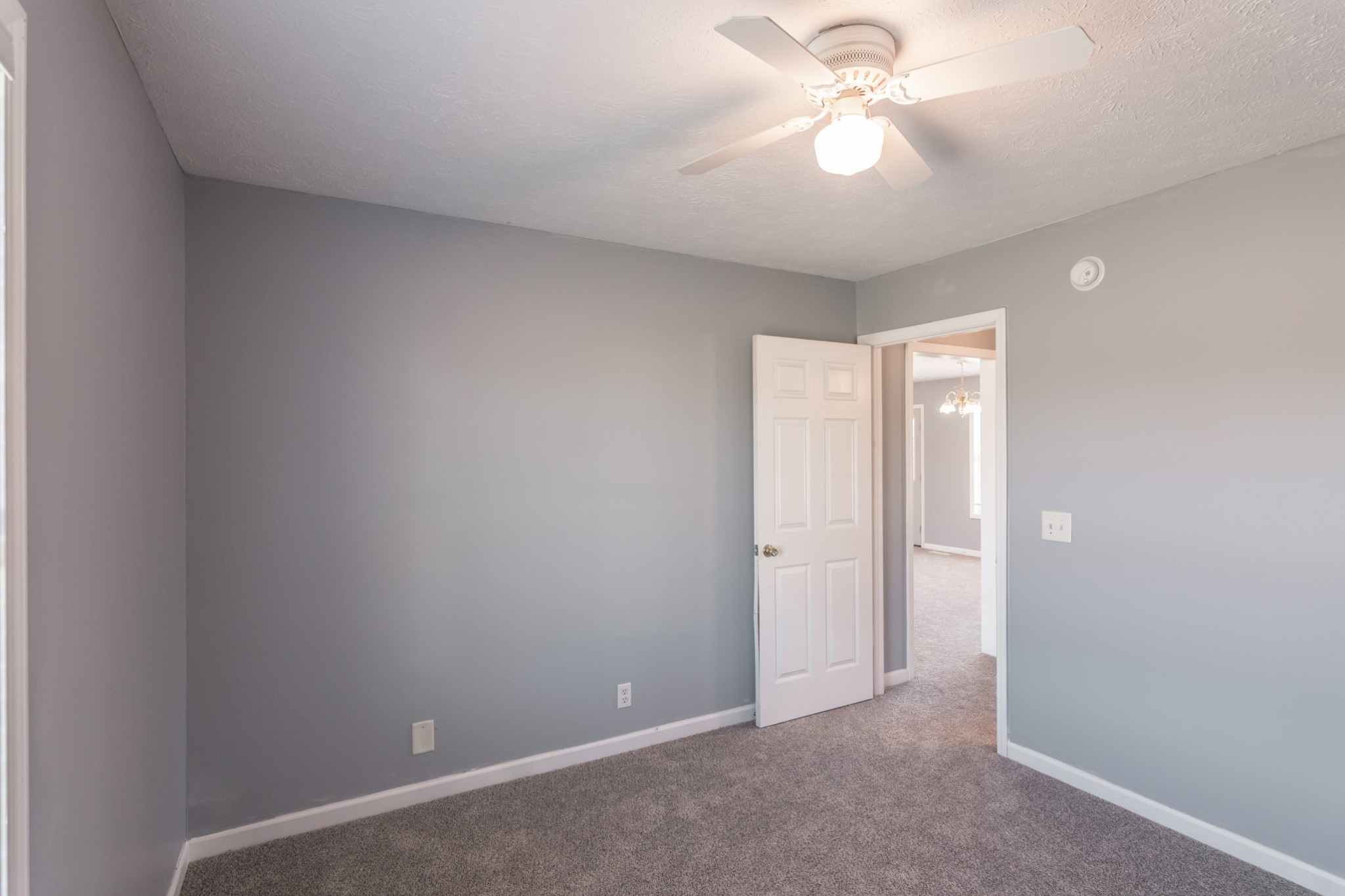 361 Corinth Road Portland, TN 37148 - Photo 32 of 46 an empty room with a ceiling fan and a fan
