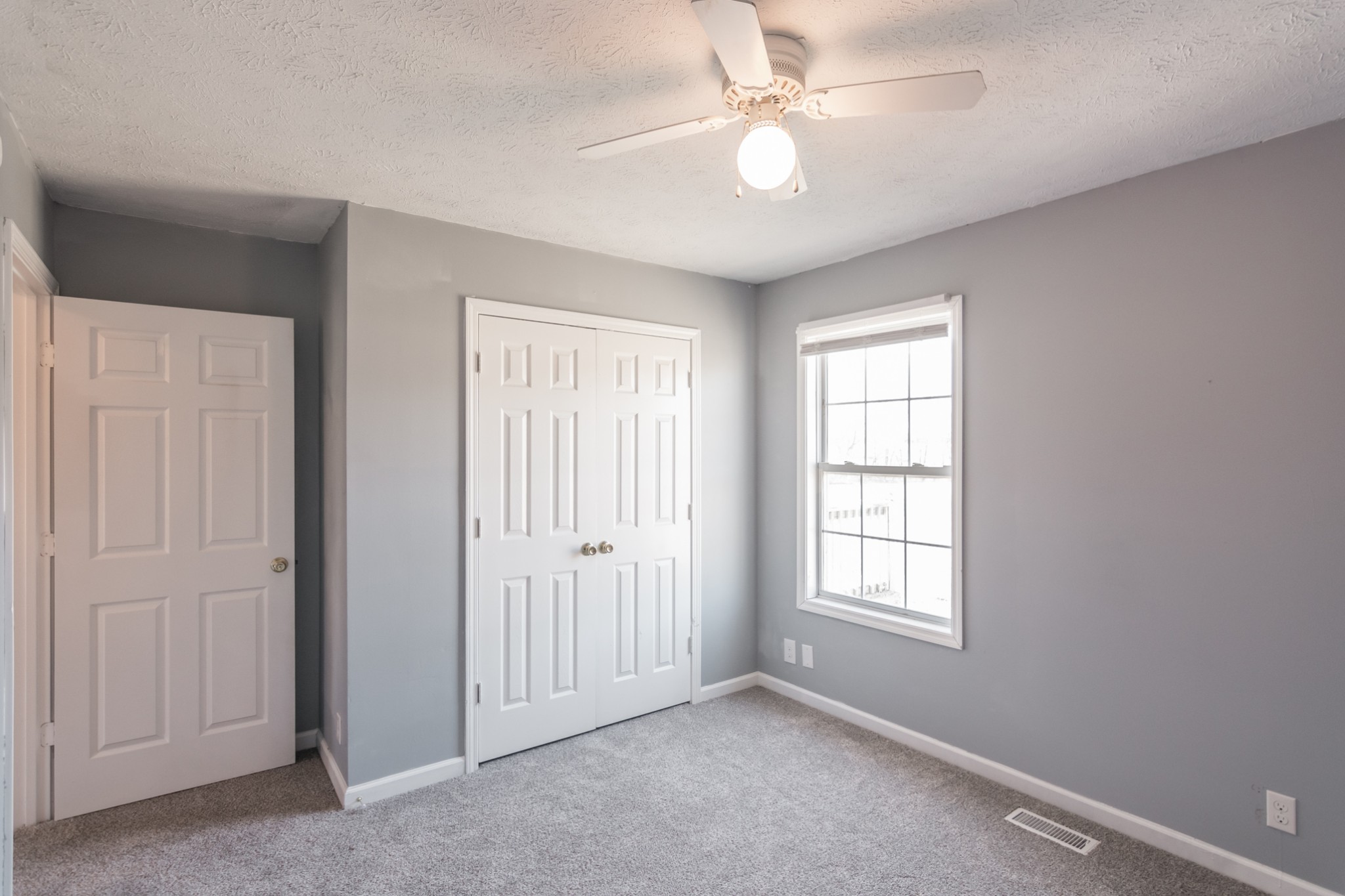 361 Corinth Road Portland, TN 37148 - Photo 34 of 46 an empty room with windows and fan
