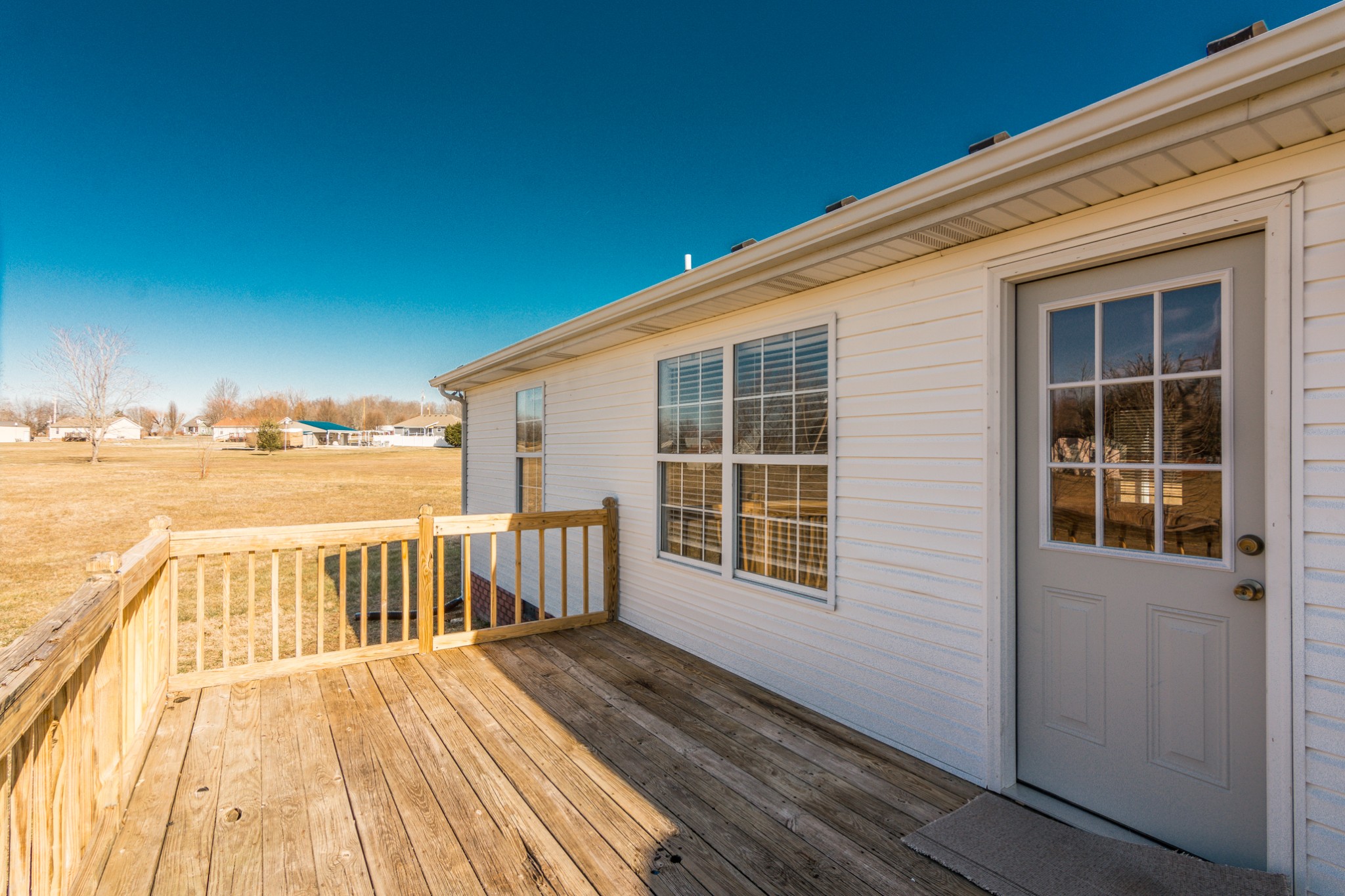 361 Corinth Road Portland, TN 37148 - Photo 37 of 46 a view of a balcony with wooden floor and seating space