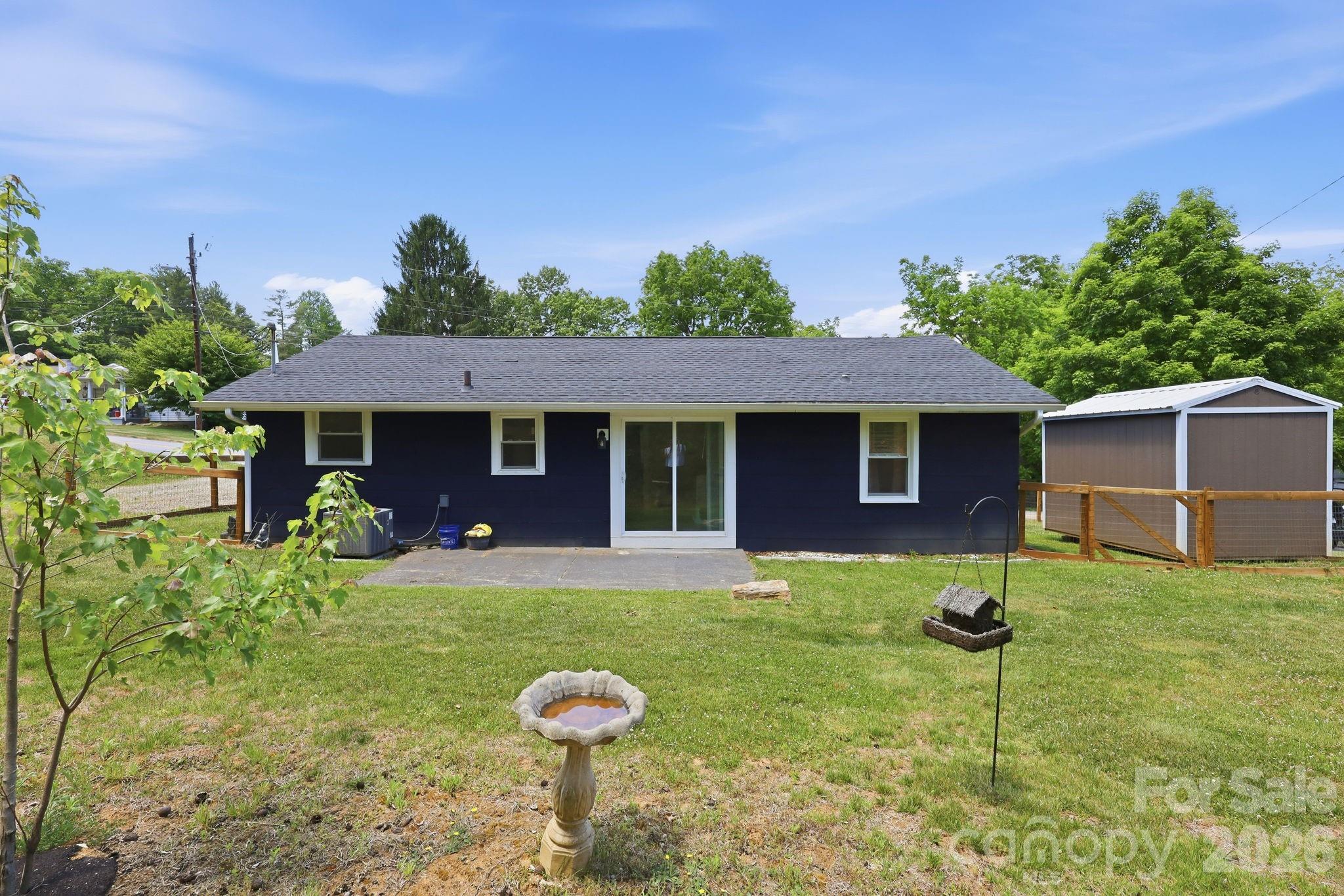 197 Mulberry Street Clyde, NC 28721 - Photo 25 of 31 a front view of a house with a yard