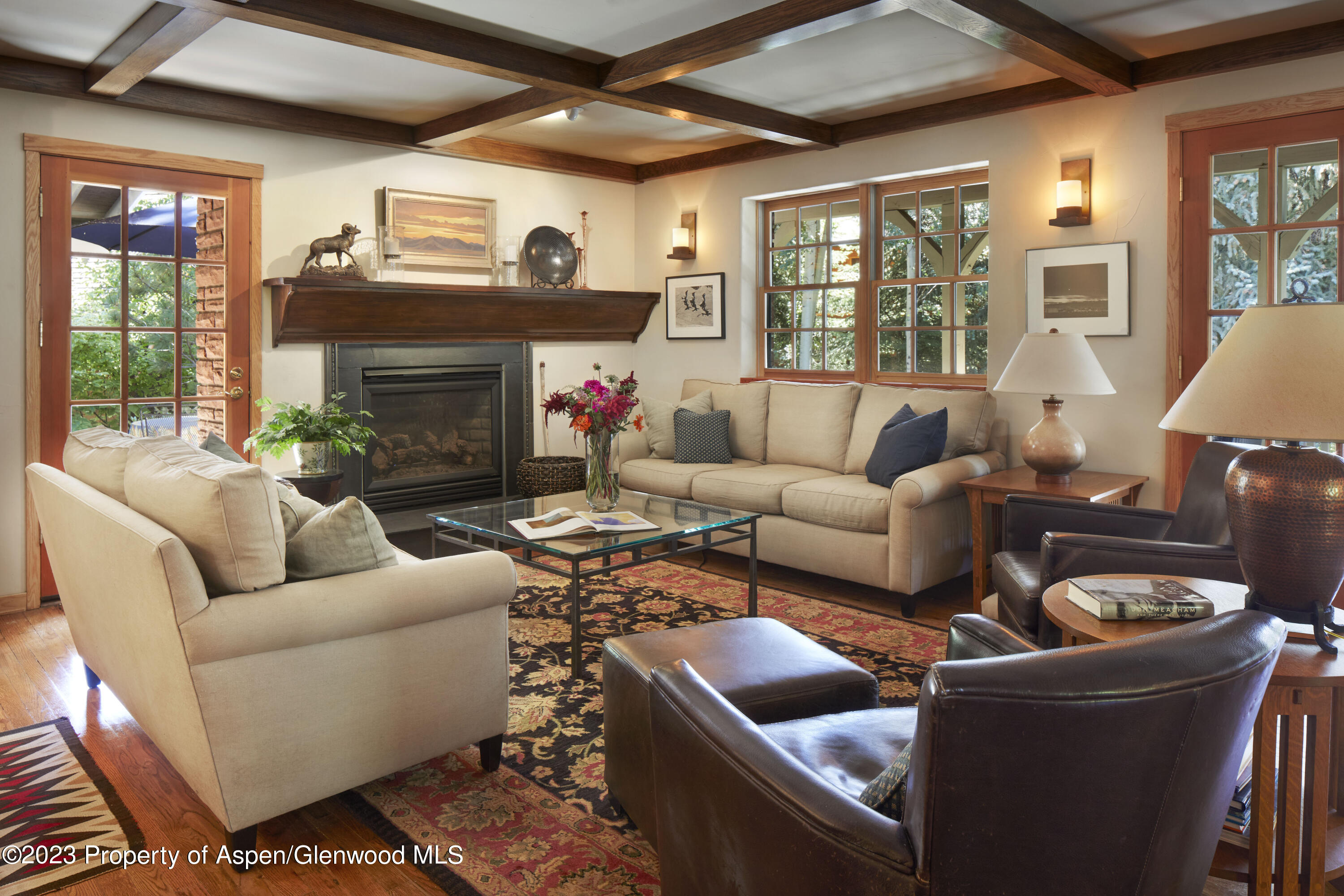 135 Riverside Drive Basalt, CO 81621 - Photo 1 of 18 a living room with furniture a fireplace and a large window
