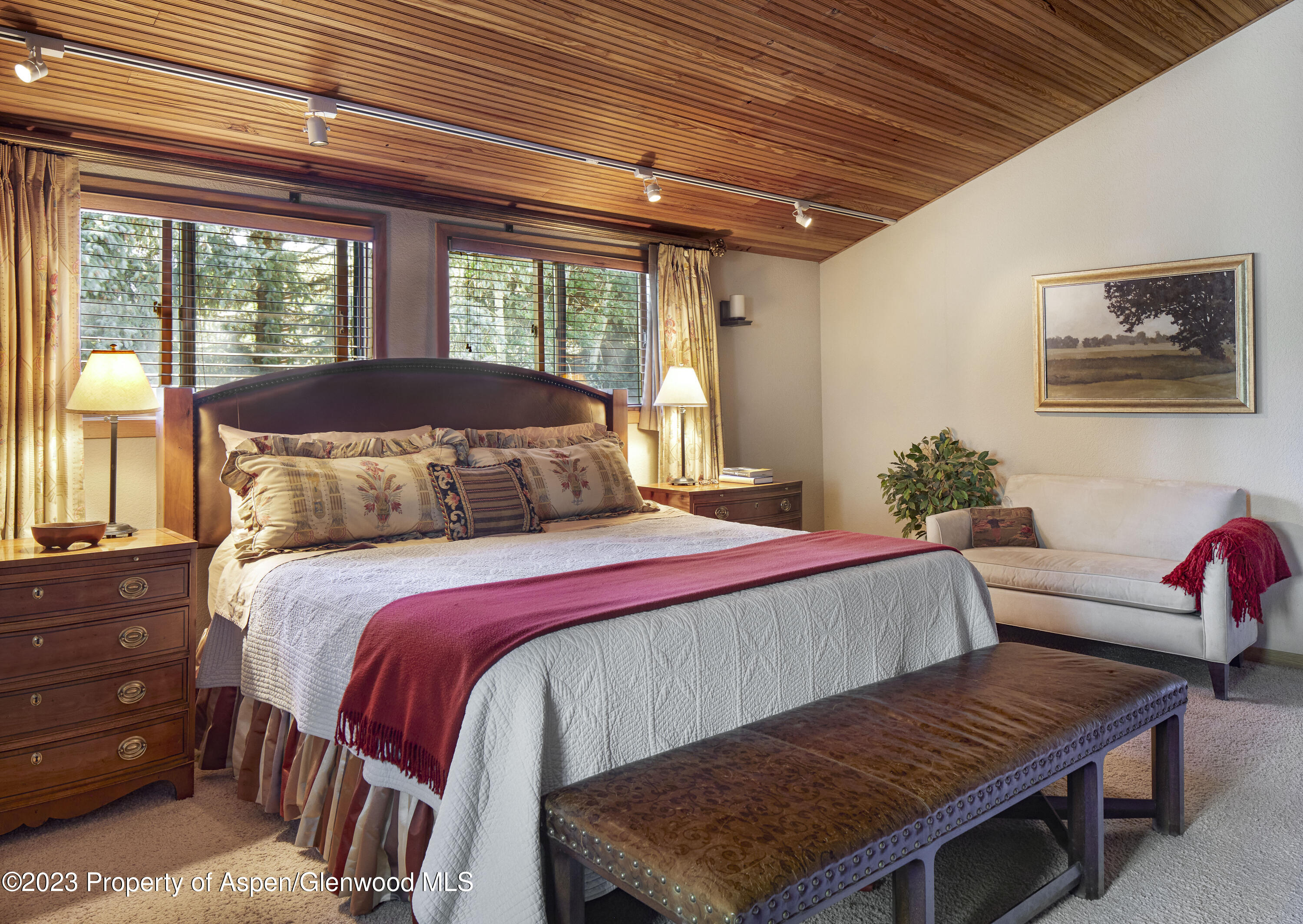 135 Riverside Drive Basalt, CO 81621 - Photo 11 of 18 a bedroom with a bed and a dresser next to a window
