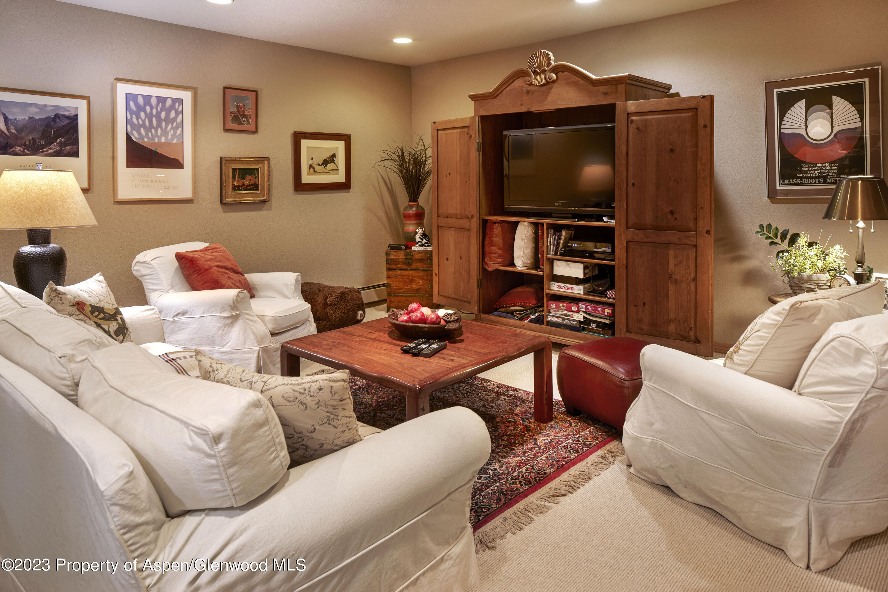 135 Riverside Drive Basalt, CO 81621 - Photo 13 of 18 a living room with furniture and a flat screen tv