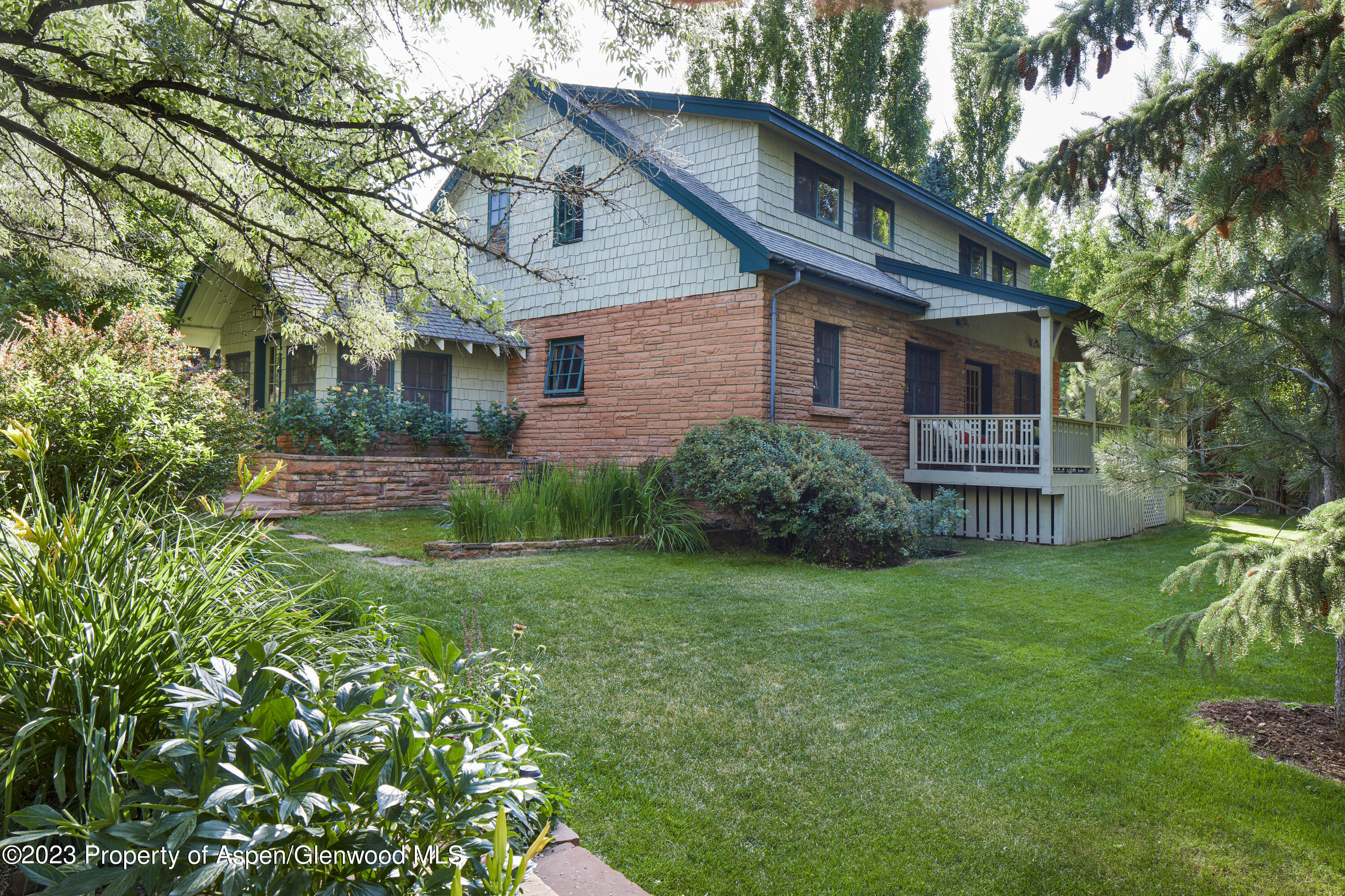 135 Riverside Drive Basalt, CO 81621 - Photo 3 of 18 a front view of house with yard and green space