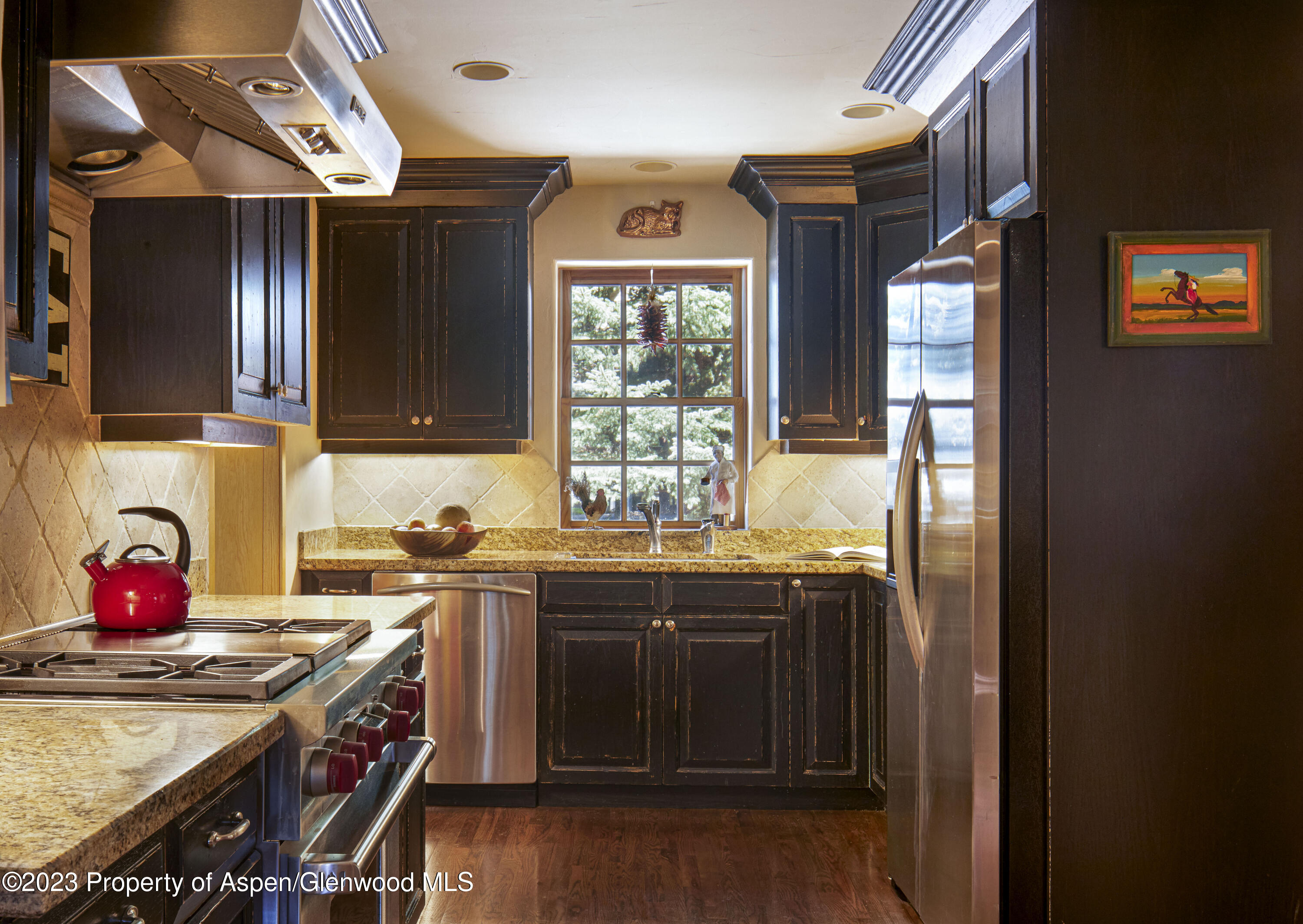 135 Riverside Drive Basalt, CO 81621 - Photo 7 of 18 a kitchen with stainless steel appliances granite countertop a sink stove and refrigerator