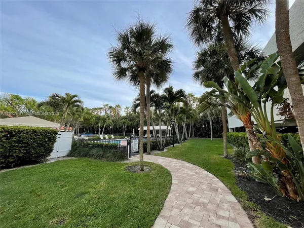 a view of a lake with beach and outdoor space