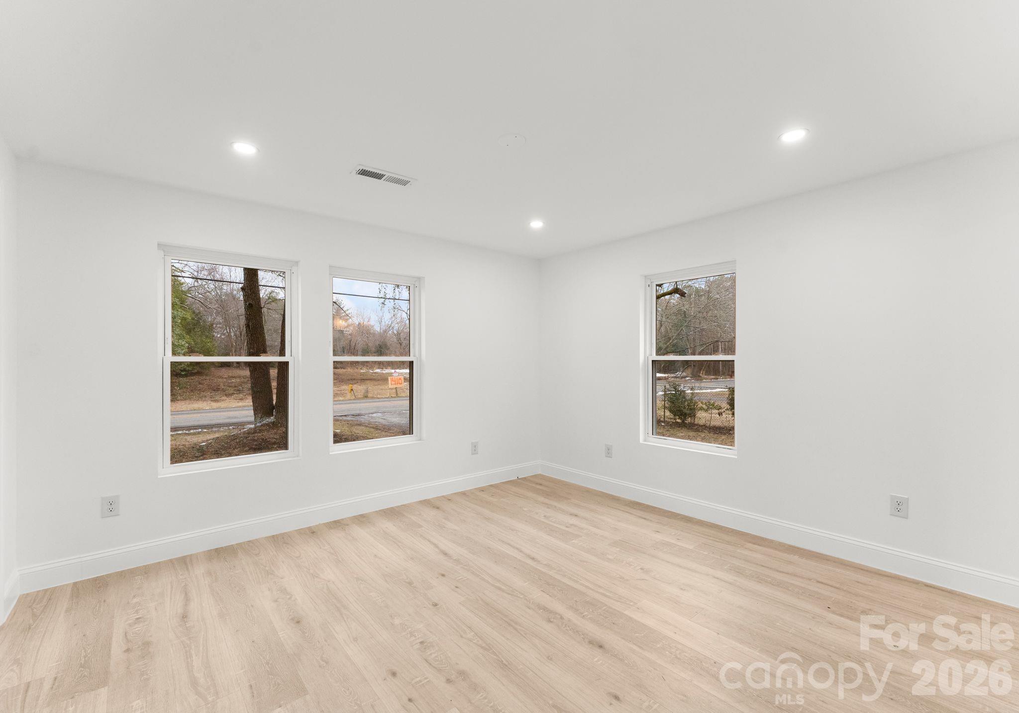 1413 Modena Street Gastonia, NC 28054 - Photo 14 of 27 an empty room with a window and cabinet