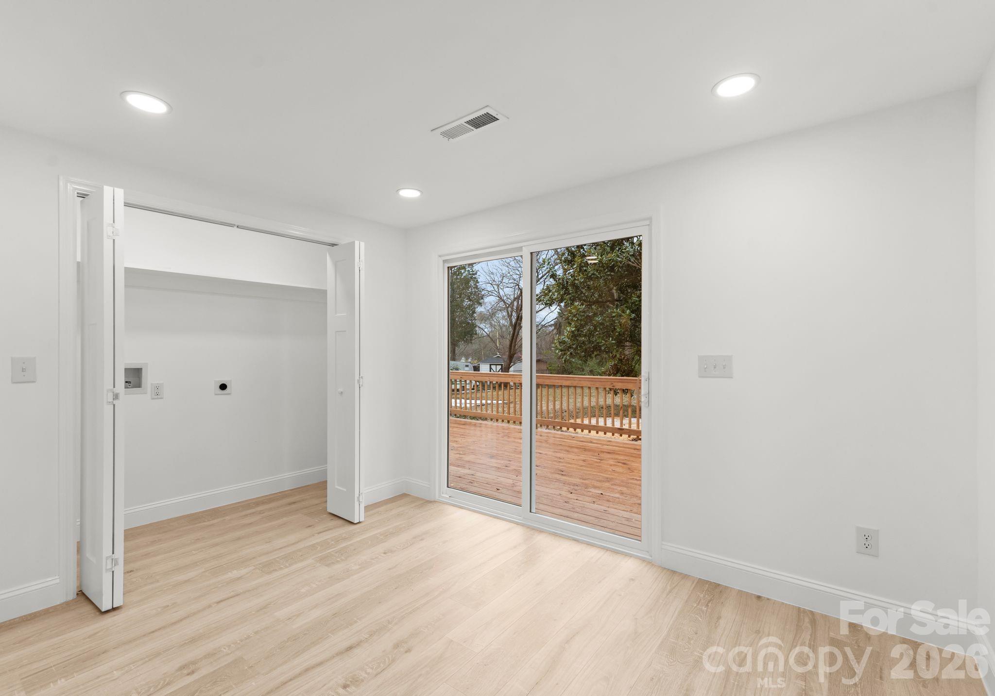 1413 Modena Street Gastonia, NC 28054 - Photo 16 of 27 wooden floor in an empty room with a window