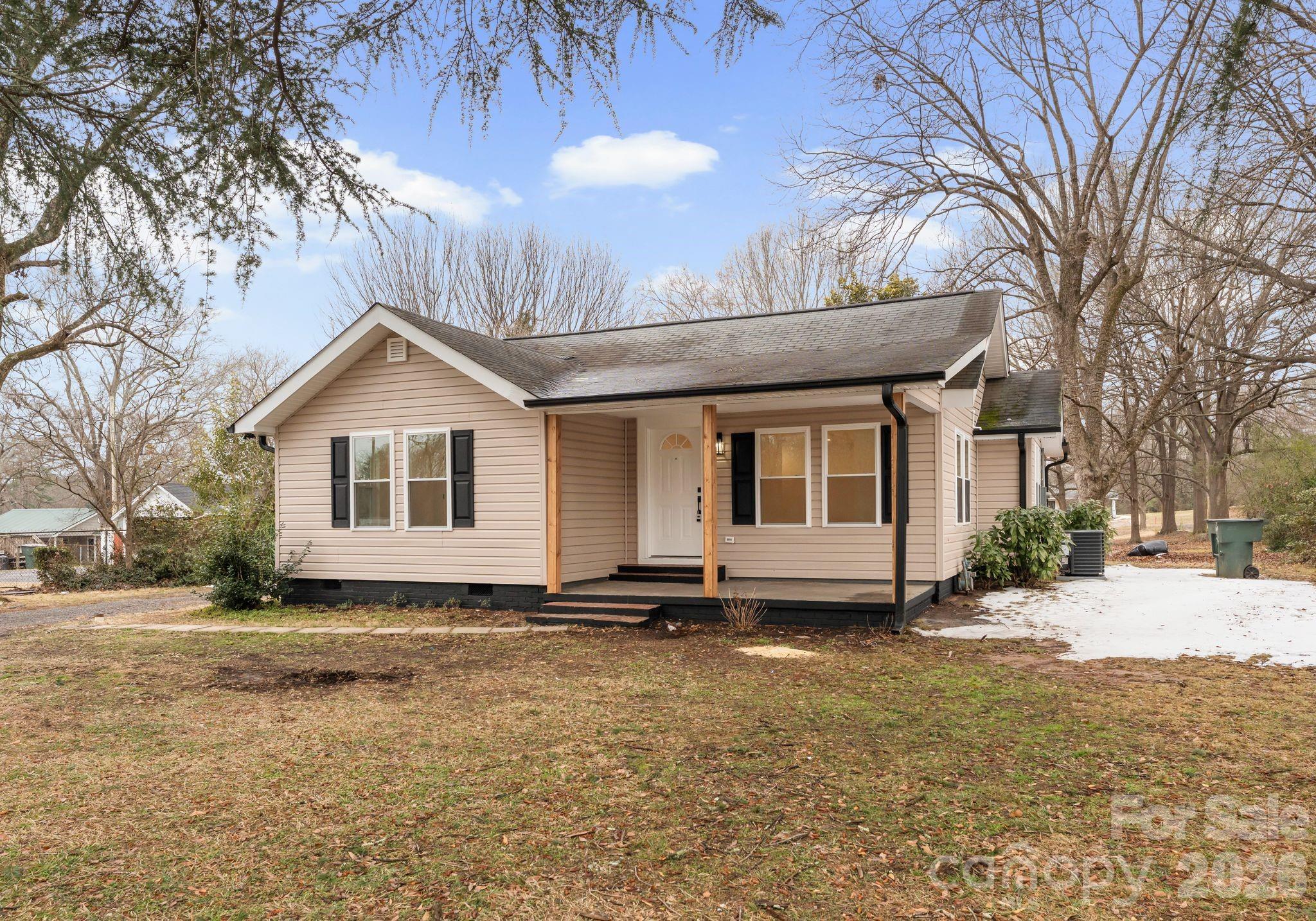 1413 Modena Street Gastonia, NC 28054 - Photo 2 of 27 a front view of a house with a yard