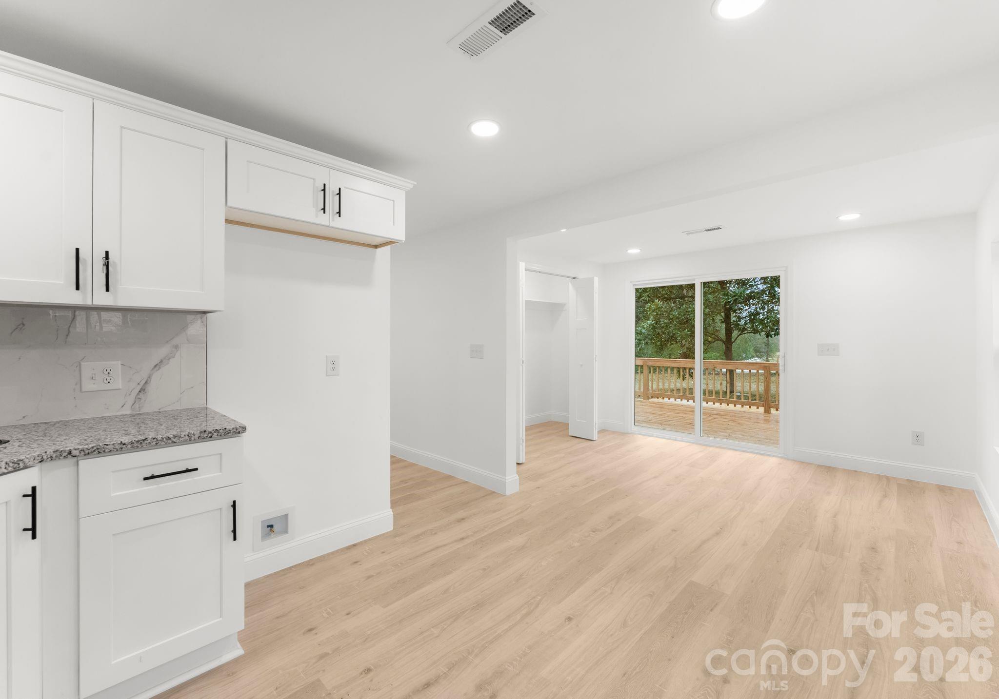 1413 Modena Street Gastonia, NC 28054 - Photo 21 of 27 a view of a kitchen with wooden floor and electronic appliances