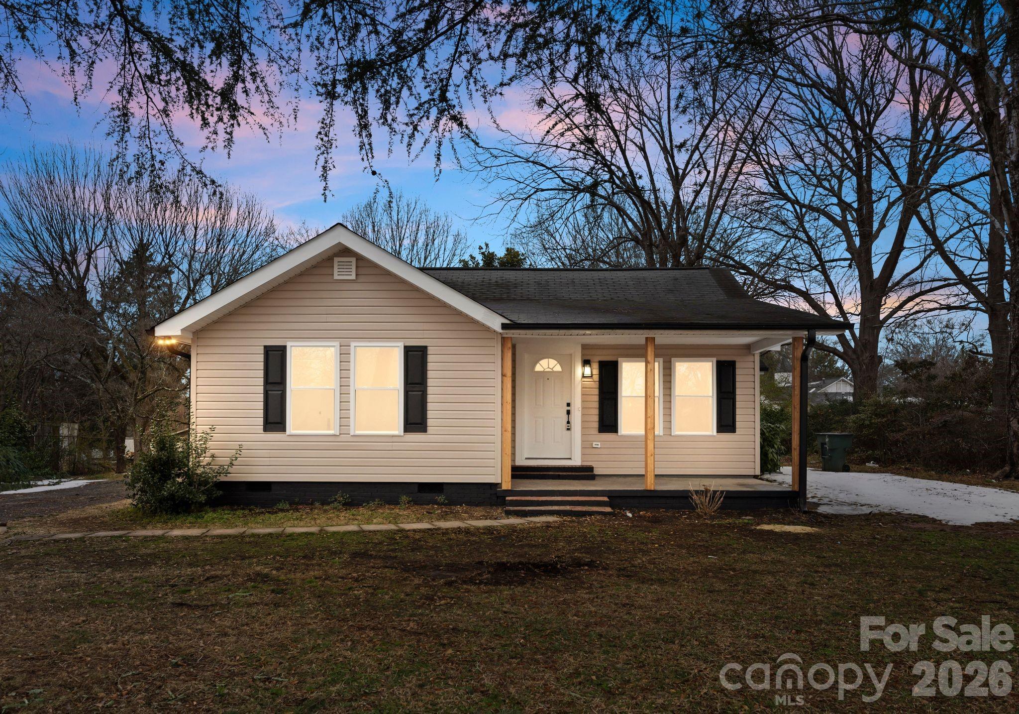 1413 Modena Street Gastonia, NC 28054 - Photo 5 of 27 a front view of a house with a yard