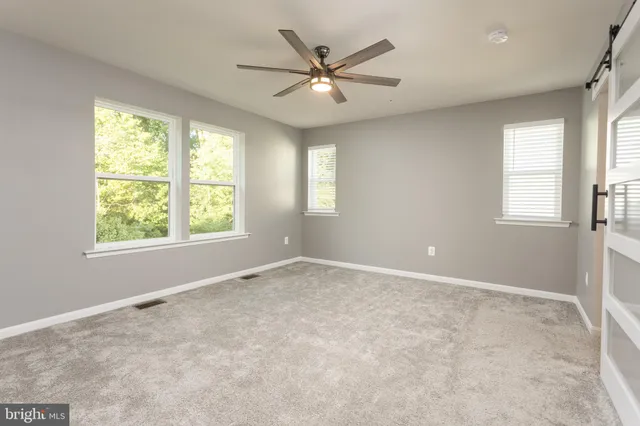 a bathroom with a granite countertop sink mirror and double