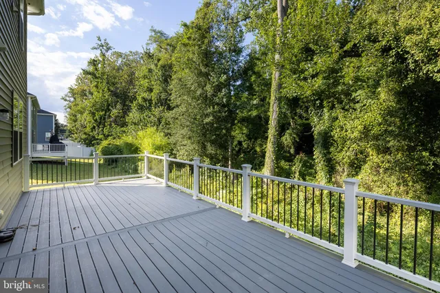a view of balcony with deck and wooden floor