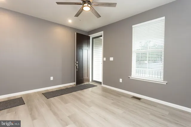 a view of an empty room with a window