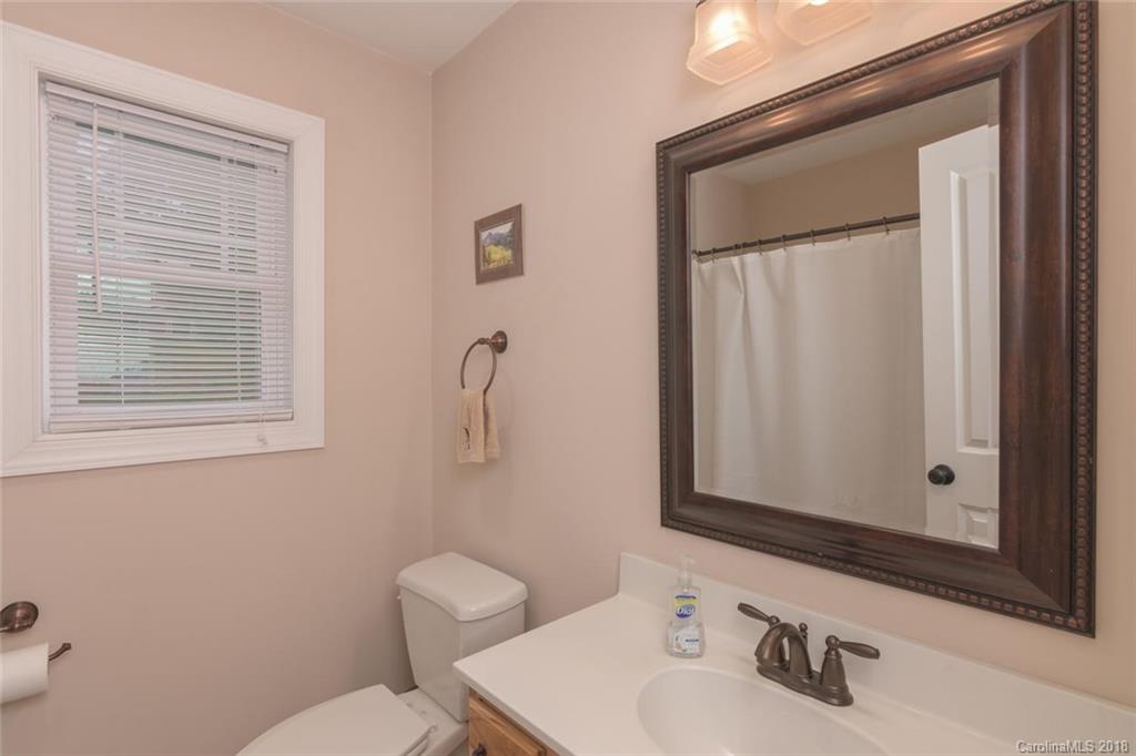 2500 Catawba River Road Old Fort, NC 28762 - Photo 11 of 24 a bathroom with a toilet sink and mirror