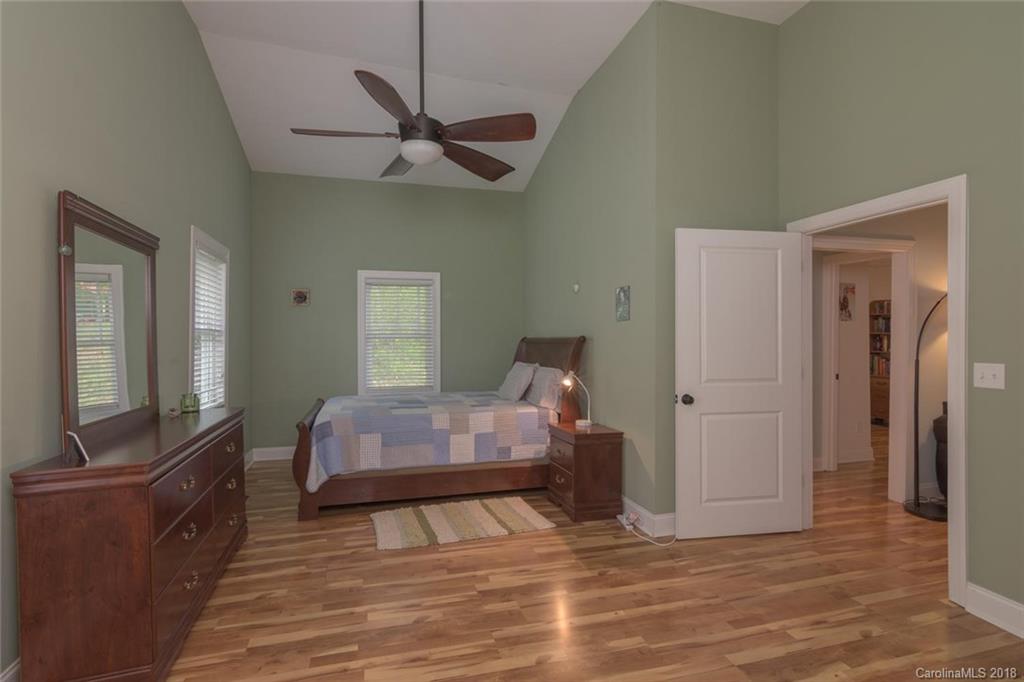 2500 Catawba River Road Old Fort, NC 28762 - Photo 13 of 24 a bedroom with a bed and wooden floor