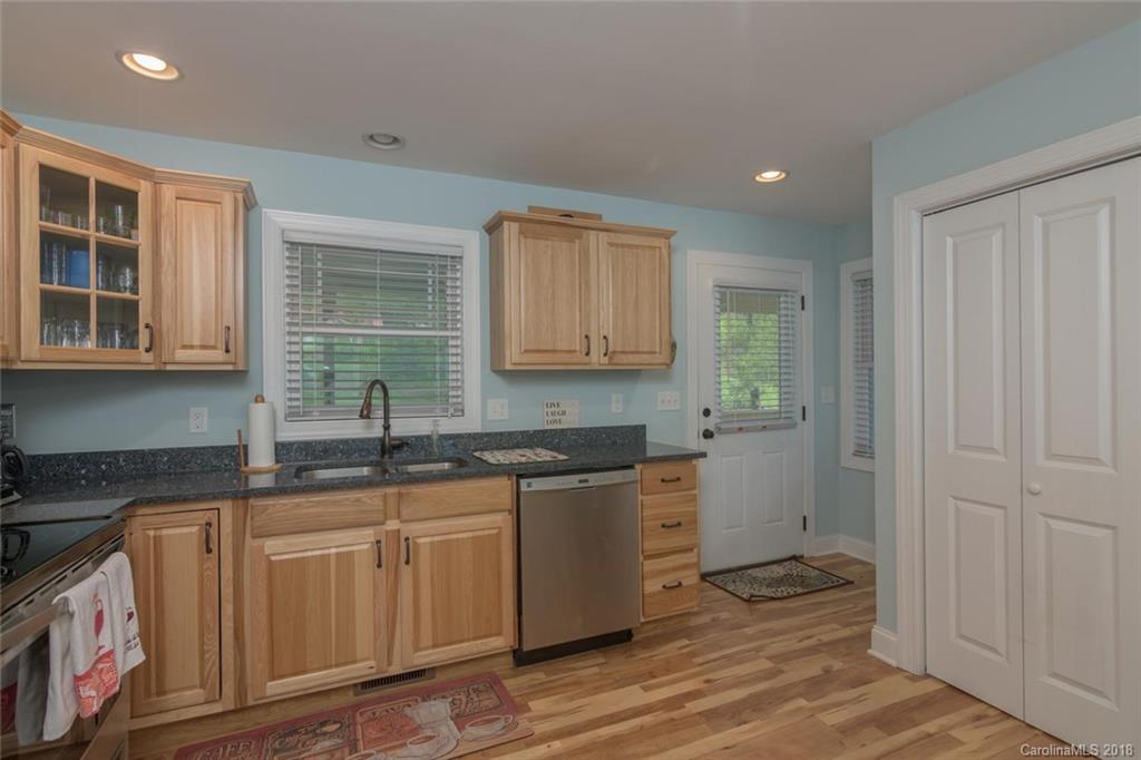2500 Catawba River Road Old Fort, NC 28762 - Photo 3 of 24 a kitchen with stainless steel appliances granite countertop a sink and cabinets