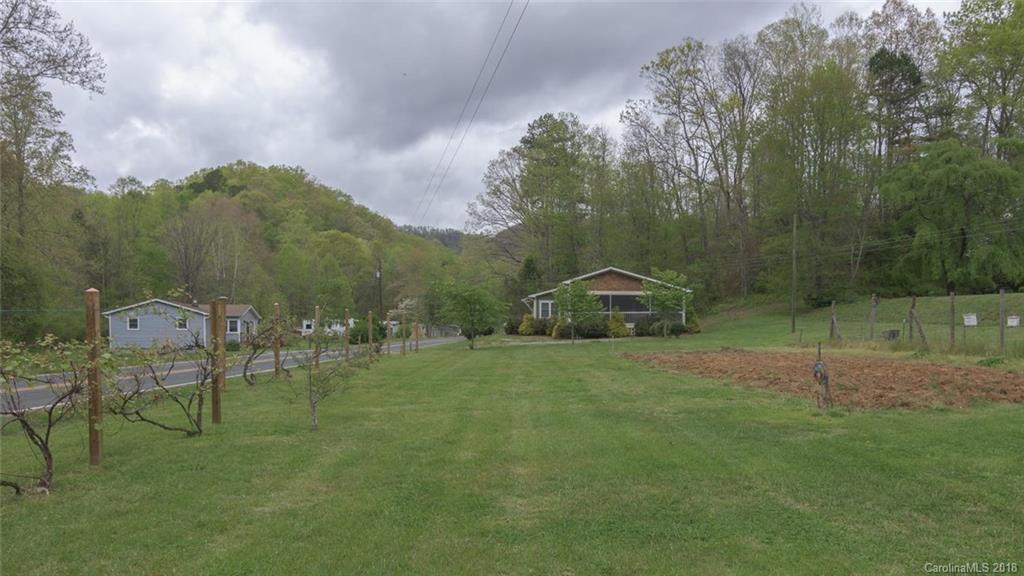 2500 Catawba River Road Old Fort, NC 28762 - Photo 24 of 24 a backyard of a house with table and chairs