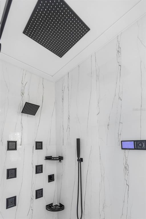 7130 102nd Lane Seminole, FL 33772 - Photo 19 of 31 a bathroom with a shower